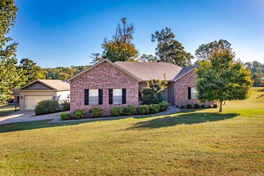 Welcome to 854 Salem Heights Drive — a stunning Benton home that blends charm, comfort, and functionality in one beautiful package. Tucked away in a quiet and desirable area just minutes from I-30, this property offers the perfect balance of privacy and convenience. Step inside to find spacious living areas filled with natural light, neutral tones, and thoughtful finishes throughout. The large living room provides the perfect gathering space, flowing seamlessly into a welcoming kitchen and dining area designed for everyday living and entertaining. The primary suite offers generous space and comfort with ample closet storage and a relaxing ensuite bath. Step outside to enjoy one of this home’s standout features — a huge back deck ideal for entertaining, grilling, or simply relaxing while overlooking the private backyard. The property also includes a detached garage/workshop, offering the perfect setup for storage, hobbies, or additional parking. The outdoor space provides room to play, garden, or unwind in peace. With its curb appeal, functional layout, and unbeatable location near shopping, dining, and Benton schools, this home is truly move-in ready and full of potential.