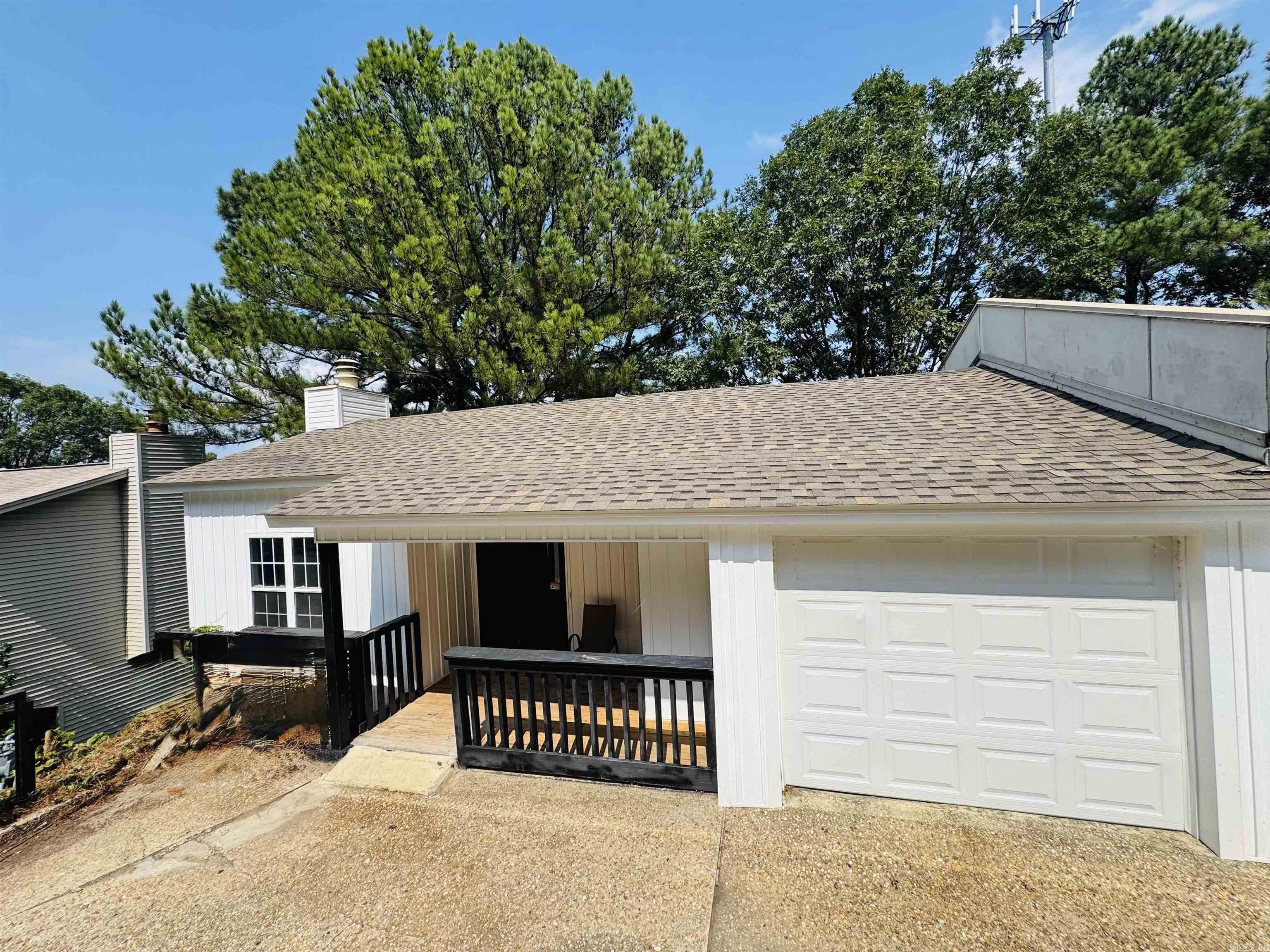 Check out this newly renovated home just minutes to all Little Rock has to offer! This 2 story town home boasts a large living area with valted wood beam ceilings and its fire place as center of attention! New roof, siding, HVAC and garage door just replaced last year as well as several updates inside... Granite tops in kitchen and all appliances will convey. Very functional layout with 2 bedrooms as well as 2 full baths and laundry room down stairs. Also offering an extra 1/2 bath upstairs with kitchen, Living Room, and walk out covered balcony. Book your showing today to make this home!!
