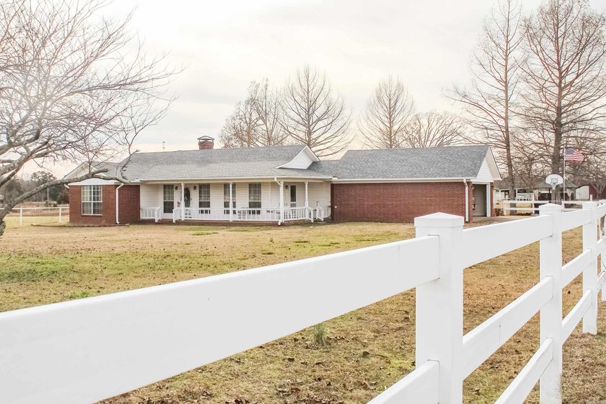 Beautiful farm style brick home, 3 bed 2 bath sitting on 10 acres. Property features a 21x35 cover back porch, nice open porch on the front, gazebo, storm cellar in the attached garage floor, 30X60 with 8x30 lean-to barn, 3 stalls, tack room, work and storage area. Land can be split into 2 pastures with both having access to the barn. New roof in 2025, new HVAC in 2022 and mineral rights do convey.  Property offers so much, great place to live and perfect for entertaining, this is a must see.