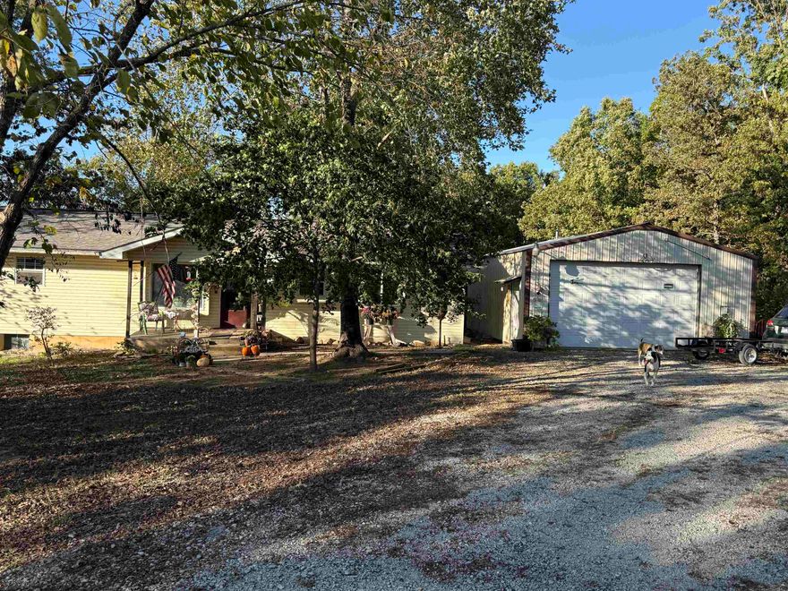 Tucked away in the scenic foothills of the Ozarks in north central Arkansas, this country home in Gepp offers the perfect blend of rural tranquility and convenience. Sitting on five wooded acres with county road frontage, the property boasts a private, natural setting with an abundance of deer and turkey. The main level of the home features 1,400 square feet with an open floor plan, three bedrooms, and two baths, plus a kitchen with ample cabinet storage and a pantry. An added bonus is the partially finished basement, which includes a fireproof gun cabinet and is already plumbed for a third bathroom. Mornings can be enjoyed on the large back deck, offering privacy and peaceful views, and the property is completed by a 24x30 two-car garage. Best of all, you're just a short drive from Mountain Home, the recreational waters of Lake Norfork, and a nearby year-round creek.