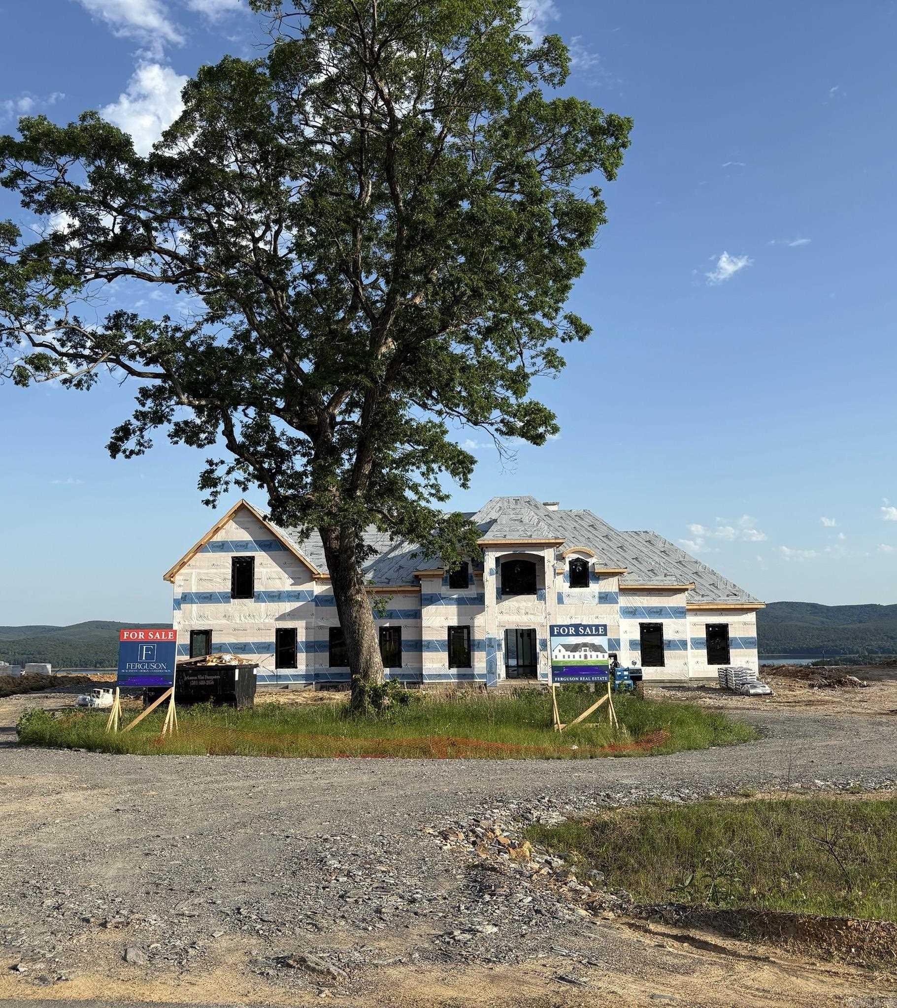 This unique home is situated on an even more unique lot boasting incredible views of Lake Maumelle and the western mountian range. The front of the lot has a beautiful oak tree that will be inside of the circle drive poured up to the front of the house! This home has a timeless front elevation. The front door leads into a two story foyer with instant views out the back of the home. The entire floor plan was designed for this particular lot and to maximize the views throughout the layout. With almost two acres the home is able to have a large flat backyard! Depending on when the home is purchased, any finishes that have not been ordered or already installed may be customized!