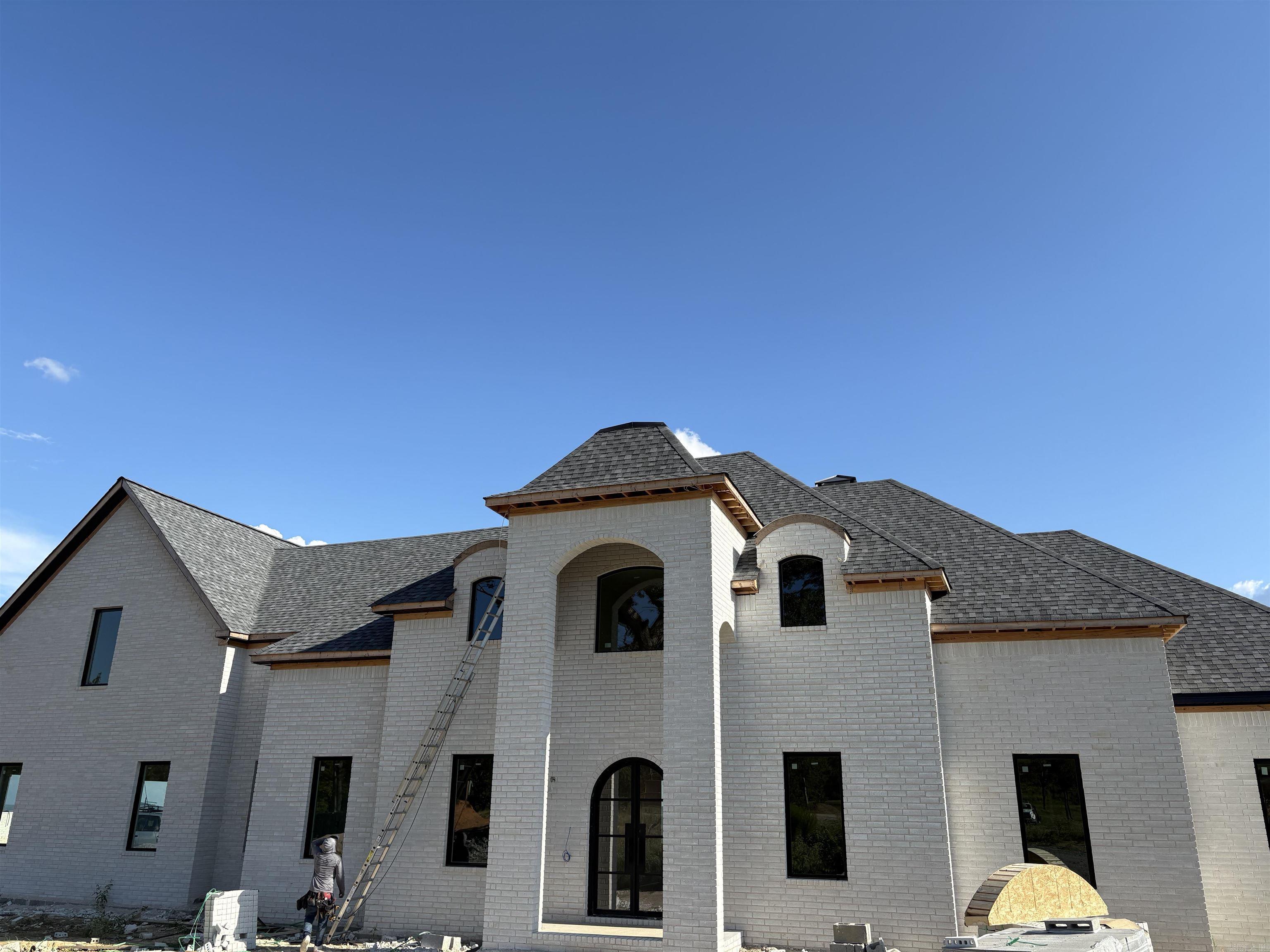 This unique home is situated on an even more unique lot boasting incredible views of Lake Maumelle and the western mountian range. The front of the lot has a beautiful oak tree that will be inside of the circle drive poured up to the front of the house! This home has a timeless front elevation. The front door leads into a two story foyer with instant views out the back of the home. The entire floor plan was designed for this particular lot and to maximize the views throughout the layout. With almost two acres the home is able to have a large flat backyard! Depending on when the home is purchased, any finishes that have not been ordered or already installed may be customized!