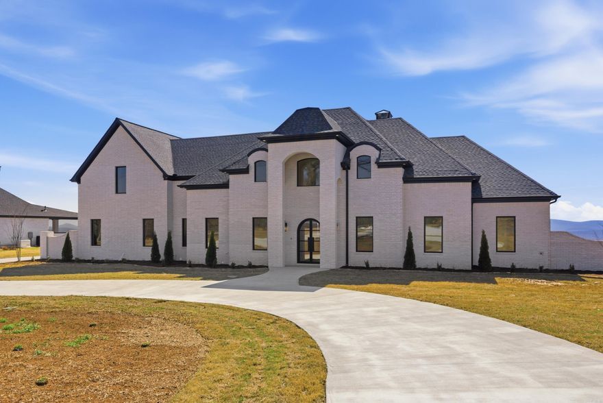 This unique home is situated on an even more unique lot boasting incredible views of Lake Maumelle and the western mountian range. The front of the lot has a beautiful oak tree that will be inside of the circle drive poured up to the front of the house! This home has a timeless front elevation. The front door leads into a two story foyer with instant views out the back of the home. The entire floor plan was designed for this particular lot and to maximize the views throughout the layout. With almost two acres the home is able to have a large flat backyard! Depending on when the home is purchased, any finishes that have not been ordered or already installed may be customized!