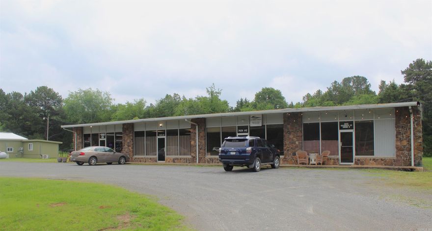 This is a MUST SEE for any & all Investors. Large offices (appx.1,000 Sq' each) with 1/2 baths in each, two units have been completely remodeled, new electric, plumbing, and sheetrock, two units have roll-up doors in back. 1 Unit has kitchen with 1 bedroom and 1 bath Rents for $500.00. 3 units rent for $400.00 each.