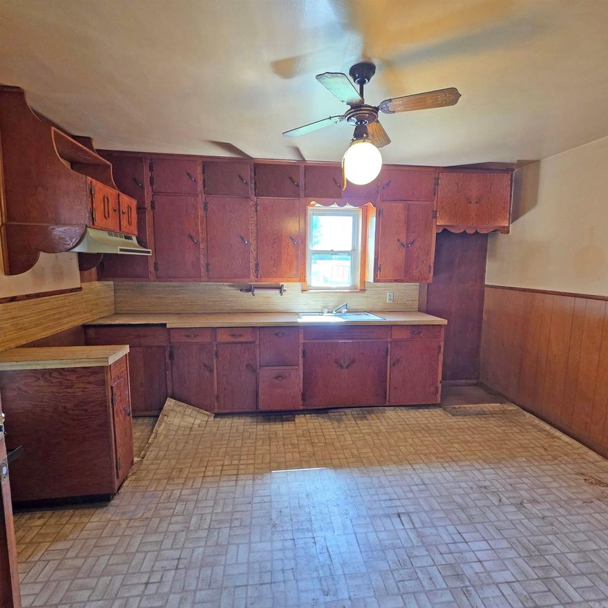 3 bedroom 1 bath home with 2 car attached carport plus a 2 car detached carport. Half acre corner lot offers room for gardening and other outdoor activities. It has a lean to behind attached garage and an outbuilding for storage and hobbies. It has a shaded front porch and front yard. The home has vinyl siding, metal roof, packaged HVAC unit, and newer vinyl windows. All offers to be submitted via Res.net by buyer's agent. Offers will be entertained after property has been exposed on the MLS for 7 calendar days. Agents read Agent Remarks