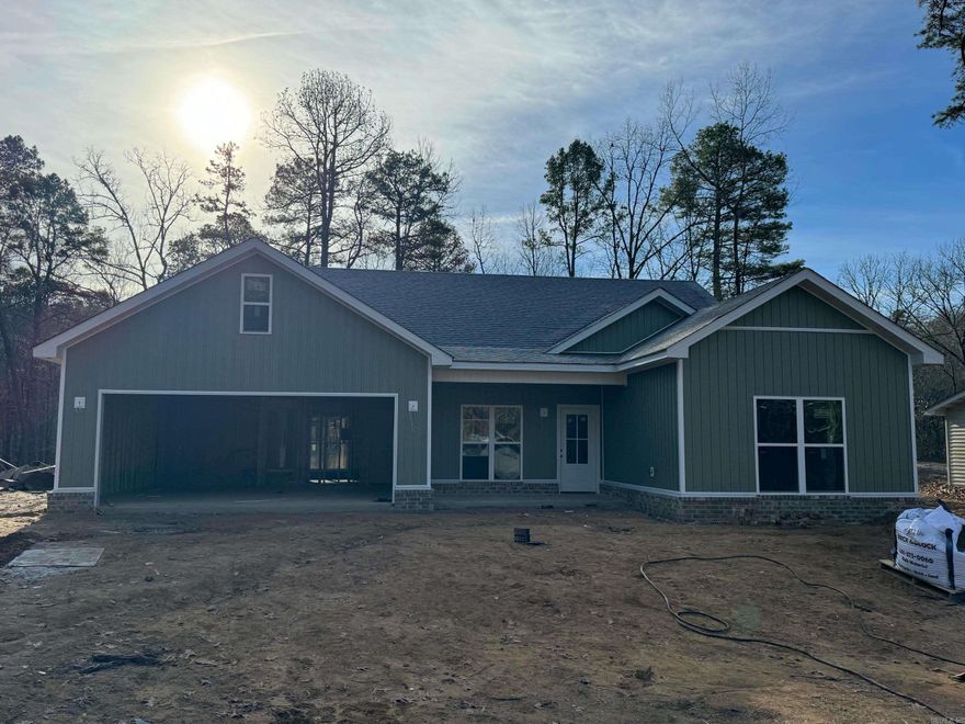 Check out this beautiful new construction home in Diamondhead Subdivision. This home is set on a quiet and tranquil, wooded lot. Featuring 3 bedrooms, 2 bathrooms and very large covered patio to enjoy the warm glow of sunlight filtering through the leaves. You will feel a sense of serenity as you delve into the intricate details of this delightful home. Open the door to an open floor plan and large kitchen with an abundance of handcrafted cabinetry. The primary bath features a custom tile shower and large master closet connecting to the laundry room. Complete with elevated finishes and luxury lighting throughout. You don't want to miss this one!