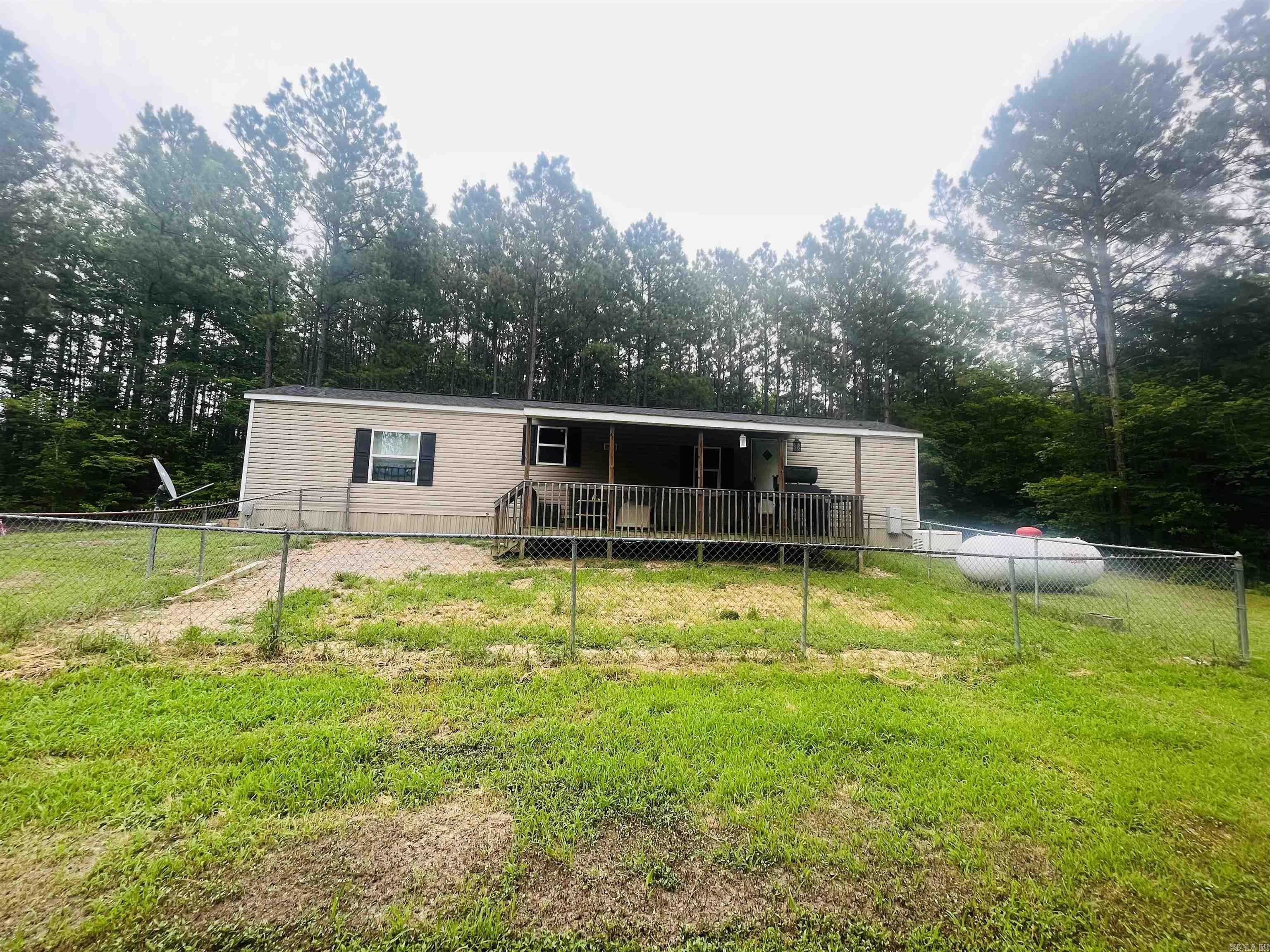 Affordable living opportunity awaits you here in this country home sitting on approx .71 acre. Built in 2016, this 2 bedroom, 2 bath home has newer LVP flooring, an adorable kitchen with a farmhouse sink, and a whole house generator. Enjoy outdoor living on the front porch or the back deck. Here's your chance, don't let it get away. Schedule your tour today.