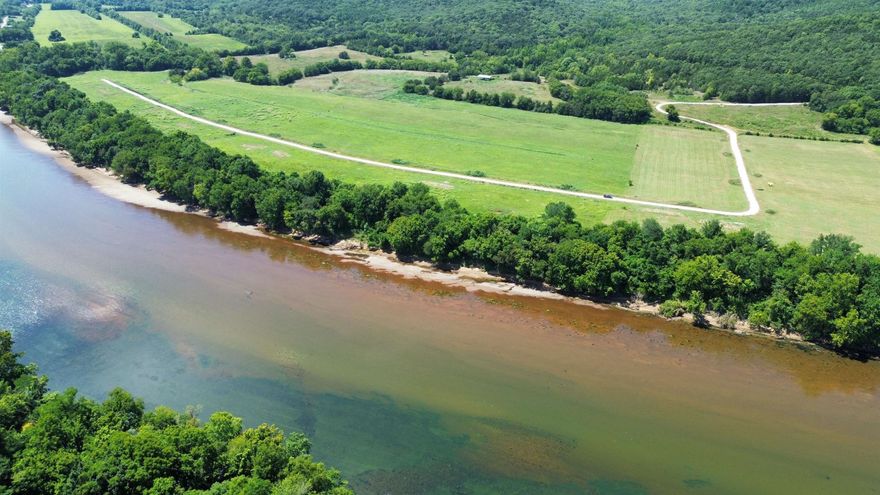 This is a beautiful 1 acre riverfront tract on the White River with 130 feet of river frontage. The property is just 2.5 miles up Hwy 5 from Anglers Restaurant & Trout Dock and 1.5 miles from Jack’s Trout Dock and Jo Jo’s Catfish Restaurant. It’s also conveniently located near the Ozark National Forest, the Ozark Folk Center, and Blanchard Springs Caverns. It’s approximately 7 miles north of Mountain View. The cleared section of land makes for an ideal building site, while the high bank offers big and pretty timber sloping gently down to the river.  Whether you’re looking to build a home, or cabin retreat, this scenic 1 acre tract provides the perfect setting and location to all the good attractions to see at Mountain View, Arkansas. This 1 acre riverfront tract is priced at $85,000 for a limited time or owner financing is offered with a 15% down payment.