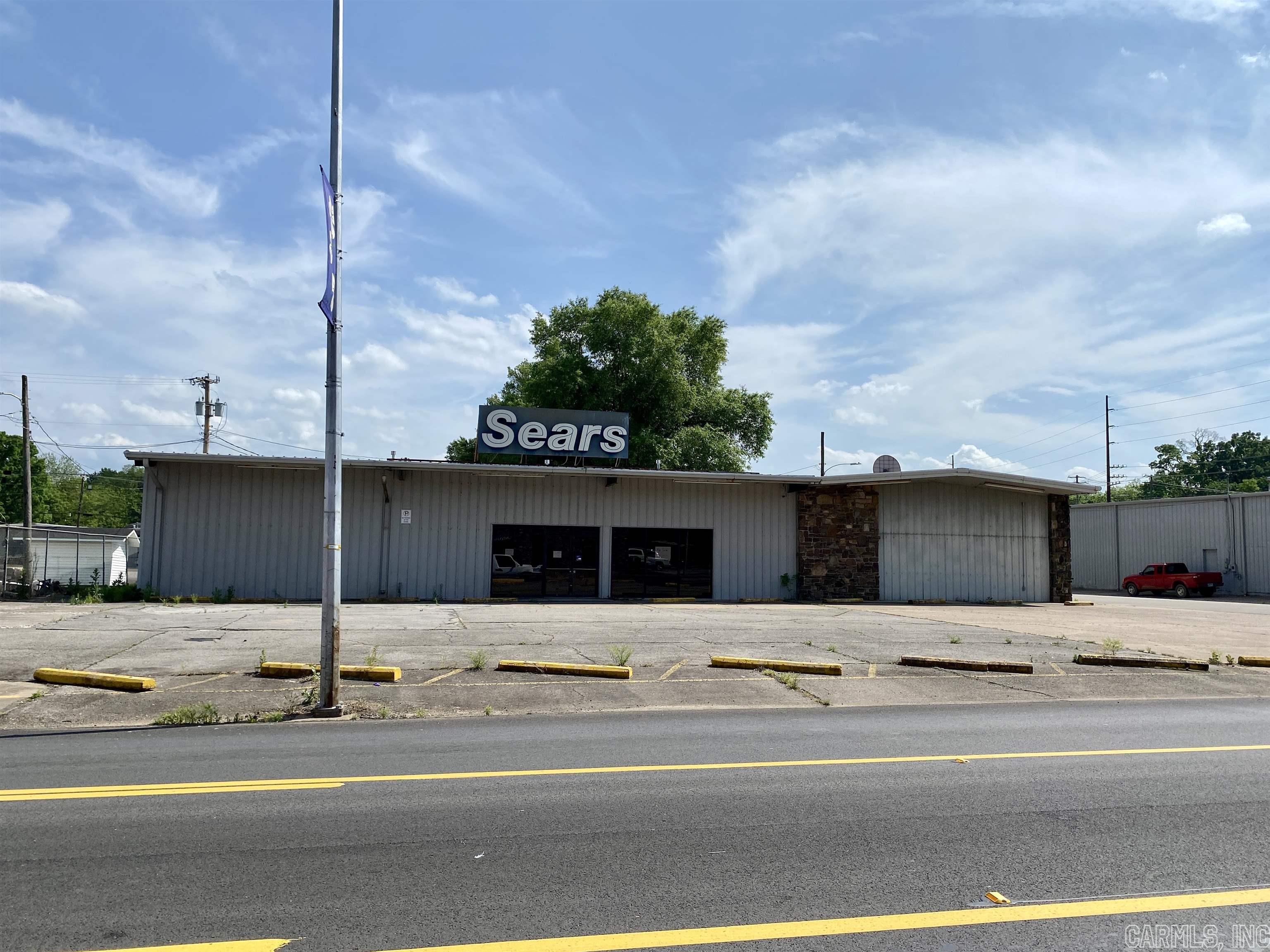 Owner Financing Opportunity with 20% down, 5.5% interest, 15 year term!!! Large Commercial Metal Building in Historic Downtown Clarksville on Main Street. Over 7800 sq.ft which includes a 5183 sq.ft H/C showroom & adjoining 2628 sq.ft warehouse w/ overhead door & ½ bath. The showroom includes a large glass storefront, open concept floor plan, drop ceilings w/ insulation above, & an abundance of electrical drops. The property includes multiple HVAC Systems, 12 asphalt parking spaces, & a security system. The property is minutes from the University of the Ozarks, Chamber of Commerce, Spadra Creek, The AR River, & Interstate 40. High Speed Fiber Internet available! The property was last used as a Sears Store. High visibility location!