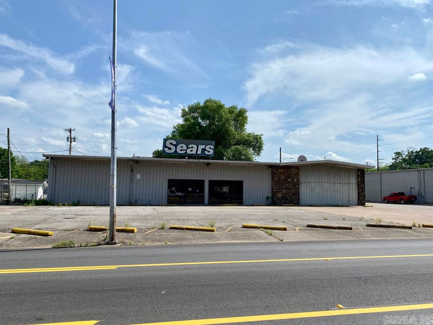Owner Financing Opportunity with 20% down, 5.5% interest, 15 year term!!!  Large Commercial Metal Building in Historic Downtown Clarksville on Main Street.   Over 7800 sq.ft which includes a 5183 sq.ft H/C showroom & adjoining 2628 sq.ft warehouse w/ overhead door & ½ bath.  The showroom includes a large glass storefront, open concept floor plan, drop ceilings w/ insulation above, & an abundance of electrical drops.  The property includes multiple HVAC Systems, 12 asphalt parking spaces, & a security system.  The property is minutes from the University of the Ozarks, Chamber of Commerce, Spadra Creek, The AR River, & Interstate 40.  High Speed Fiber Internet available!  The property was last used as a Sears Store.  High visibility location!