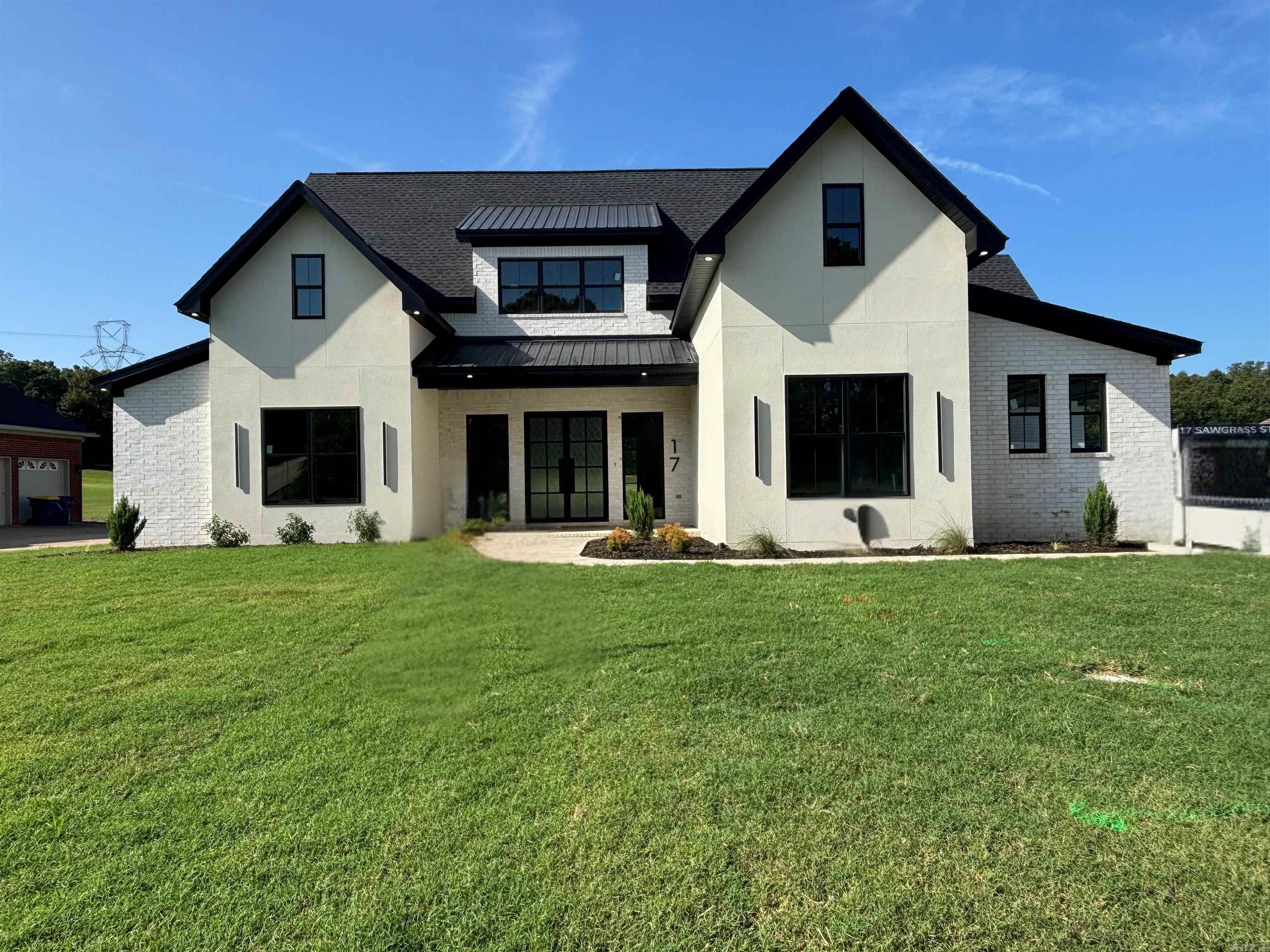 Welcome to this stunning Modern Inspired home, right on the Golf Course in Greystone. This is a 4 bed, 3 full bath home, that is full of custom trim and tile work. So much attention to detail went into to building this home. From the vaulted ceilings, Euro style cabinets, gold accents throughout the home, this one is sure to check off all the boxes for the modern and sleek designs that a trending right now. When you walk in from the front door you are immediately greeted by the high ceilings and stunning Great room, to the right is the kitchen/dining area. Master Bedroom is off the dining room, where it wraps around to the master bath, closet and into the Laundry room. Guest beds are on the left side of the home with a full bath and a jack and jill bath between the rooms down the hall. Each guest room has a walk in closet. From the Accordion style back door, you will be gazing upon the Greystone Golf Course, a stunning view and easy access to start a round of Golf. The amount of storage space that this home provides is something you wont want to miss out on. You will honestly have to see this home in person to see what all it has to offer! Professional photos coming soon.