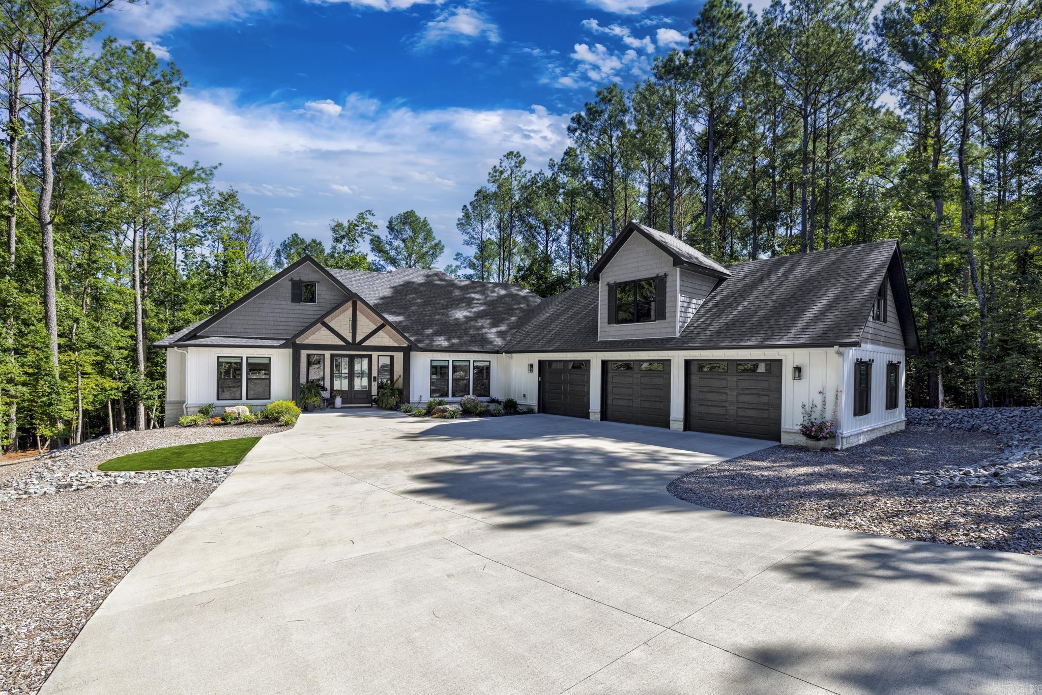Built in 2023, this gorgeous custom-built Renaissance home is situated on secluded treed lot offering a close-up view of nature. If you love kayaking, boating, fishing, the Lake Granada boat ramp is a short walk away! This 4 bedroom/2.5 bath home was built with custom details adding to the beauty and comfort of this home. Living room features wood ceiling, built in cabinetry with floating shelves flanking the fireplace, plus custom bar area. The kitchen boasts a large island with custom cabinetry reaching to the ceiling, + coffee bar area with extra cabinets and counter space behind a barn door! Guest rooms feature walk in closets. Primary has room for sitting area, primary bath features standalone tub, dual sinks, walk in shower. Primary closet leads to huge laundry-mud room with loads of storage. Oversized 3 car garage is 49' wide with room for workshop. There are 3 separate garage doors in front + middle bay has doors that open on the front and back of bay with 10' door. Backyard features professionally built in fire pit & conversation area to enjoy nature! Inside staircase leads to addt'l 500 sq ft ready to be finished out for bonus room. See addtl upgrades list in Documents.