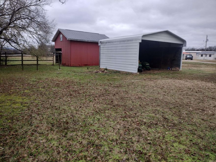 This lot is in prime location with road frontage on N Bayou & Green Ave. A 2 car carport and barn/storage shed great place to build your new home.