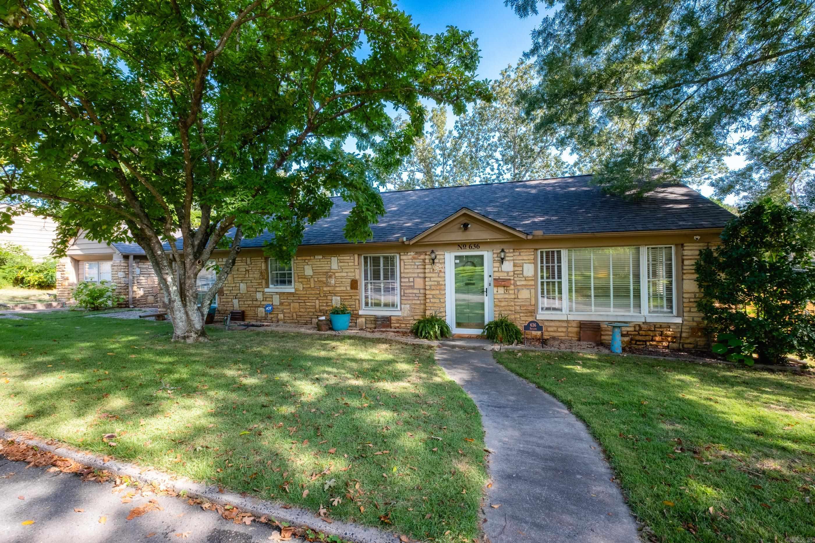 Located in Historic Park Hill, this darling 3-bedroom, 2-bath stone bungalow is move in ready. Boasting 1,841 square feet of charm and character, this home features original hardwood floors, an arched doorway, and abundant natural light throughout. The living room flows seamlessly into a formal dining areaāperfect for entertaining. The primary suite offers a private bath with walk-in shower. Two additional bedrooms share a full hall bath. Enjoy outdoor living on the spacious covered porch or relax in the large, fenced backyard. This home is located on the upper part of Skyline drive ā a tree-lined street just minutes from shopping, dining, and Argenta. Recent updates include a tankless water heater and a new shower pan in the master shower. Donāt miss this opportunity to own a piece of Park Hill history!