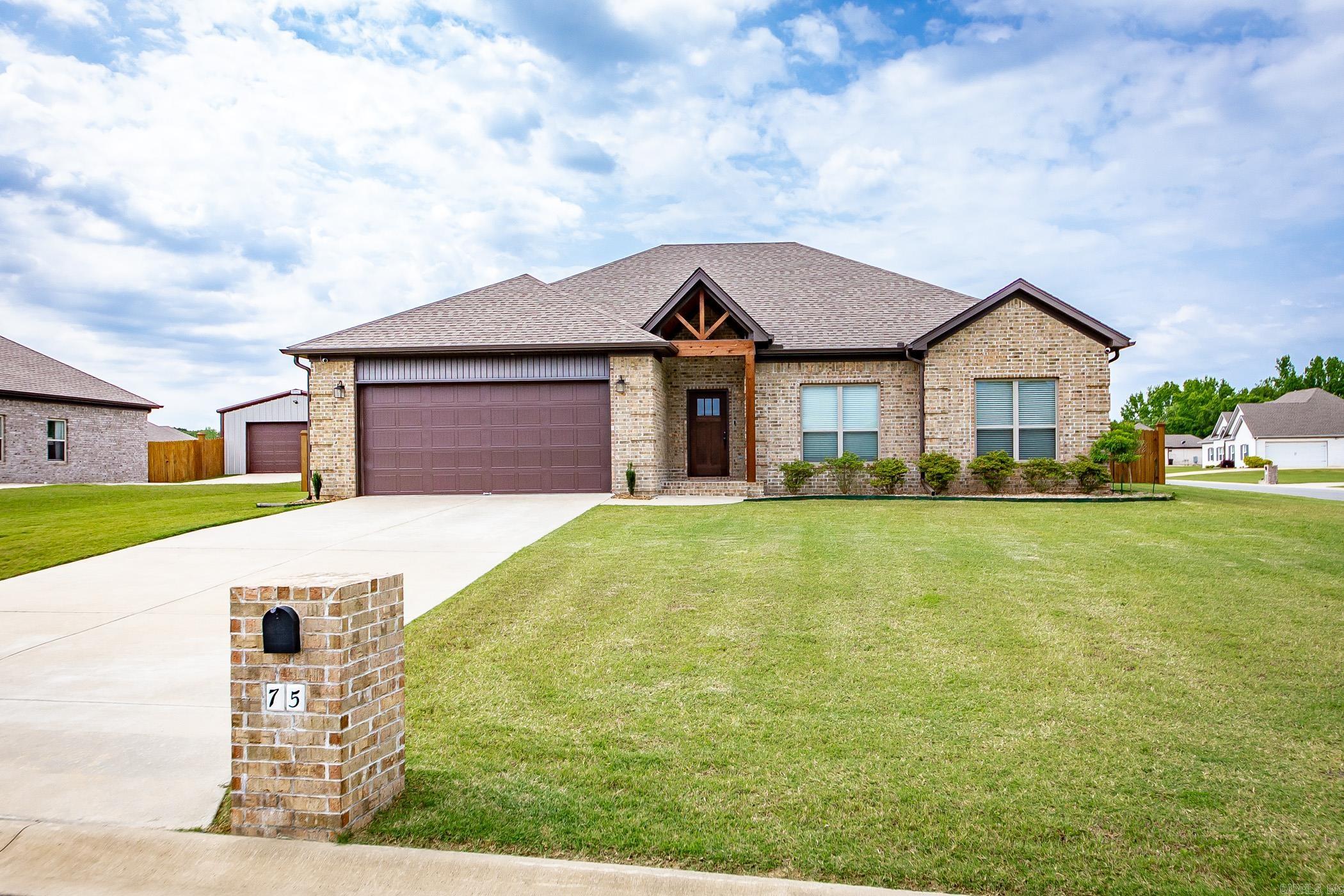 This beautifully crafted, newer construction home offers modern living with a touch of country charm. Situated on a spacious half-acre lot, this 4-bedroom, 2-bath residence provides a functional and elegant layout ideal for families and entertainers alike. The heart of the home features an open-concept kitchen that seamlessly flows into the living area, enhanced by coffered ceilings that add architectural interest and a sense of grandeur. The split-bedroom floorplan ensures privacy for the primary suite, which is thoughtfully separated from the secondary bedrooms. Outdoors, you'll enjoy a fully fenced backyard, perfect for pets, gatherings, or simply relaxing in a peaceful setting. Located just minutes from town, this home offers the best of country living with close proximity to in town conveniences.