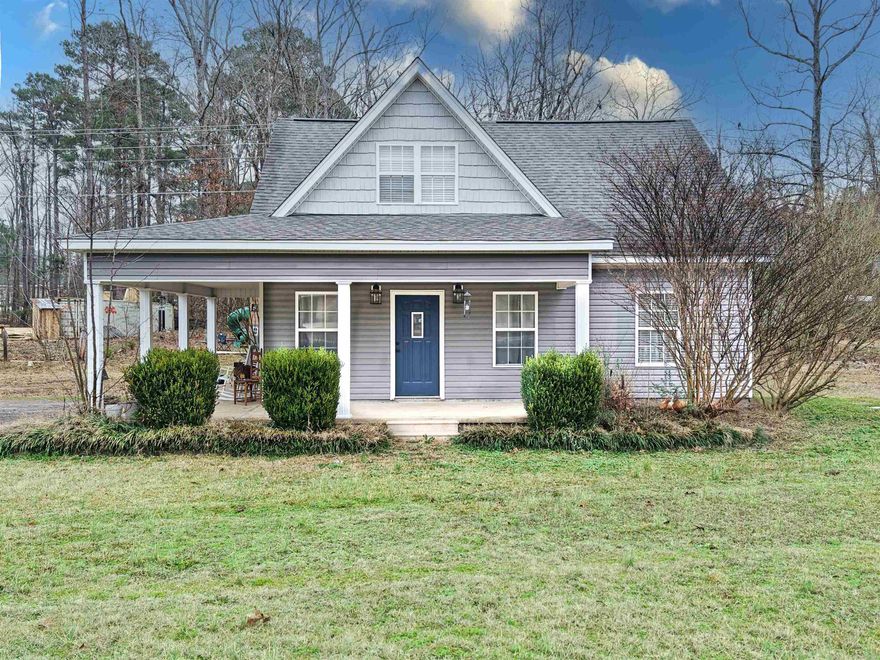 Check out this perfect, open floor plan-  3-bedroom, 2-bath home nestled on a spacious 0.88-acre lot in the Sheridan School District. This well-maintained property features fresh interior paint, updated light fixtures, and partially repainted kitchen cabinets for a bright, refreshed feel. The kitchen comes equipped with a refrigerator and stove approximately one year old, and the washer and dryer will remain with the home. Recent updates include a new ridge vent installed on the roof and a new heating element in the water heater. The primary bedroom offers two closets for added storage. Enjoy outdoor living on the large porch and on the deck overlooking a generous backyard complete with a garden area, playground space, and mature peach, blueberry, and blackberry trees. Rural Development eligible, offering potential $0 down financing. Peaceful country living with room to grow—don’t miss this opportunity! See agent remarks.