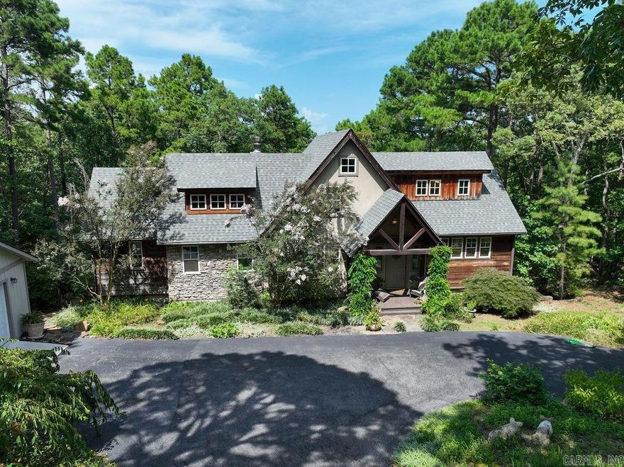Beautiful timber frame home featuring a stunning rustic style interior with a vaulted ceiling of natural wood creating a warm cozy feeling, exposed wooden beams with rough-hewn floors add to the character and charm. The focal point of the room is the large wall of windows looking out over Greers Ferry Lake, with an easy walk to the water where you can relax on your own private shale beach! The kitchen is so inviting with windows looking out over the front of the landscaped yard with plenty of workspace! This home has 5 bedrooms, 4 1/2 bath, 3 living areas, 2 fireplaces, wet bar, new roof and circular driveway. This property is very unique and is the perfect setting for a peaceful getaway! Don't miss out on this one!!!!