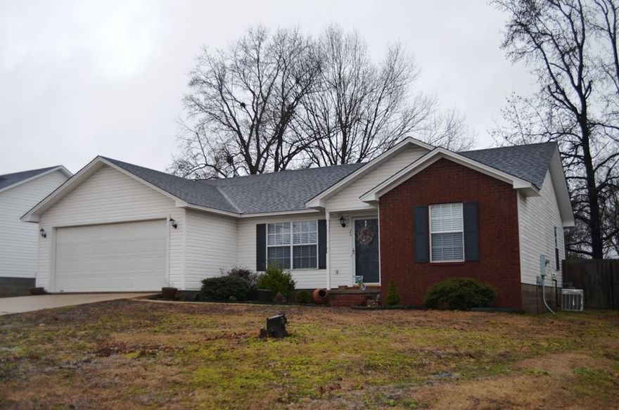 Wonderfully updated throughout! New ceramic tile flooring, recently painted, new kitchen sink, stove, microwave, new window blinds & roof is only 2 y/o! The home features a split bedroom plan featuring large bedrooms and good sized closets. The spacious great room features a vaulted ceiling and bull nose finish corners. Fully fenced backyard has a large deck for family & friends entertaining!!