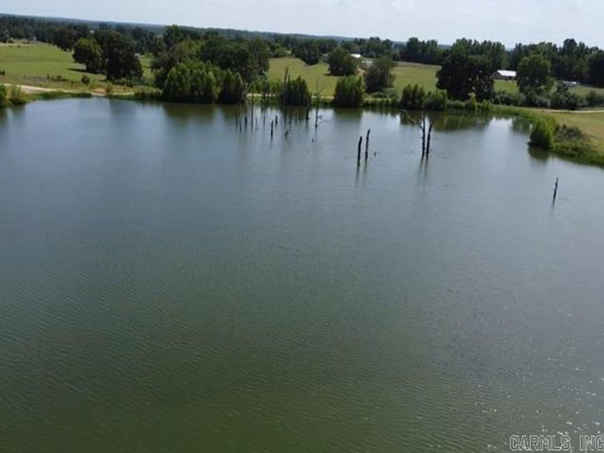 Beautiful custom built 3 bedroom 2 1/2 bath home overlooking a private lake offers an open kitchen/living/dining area with large island in the kitchen. Master suite has large walk-in closet and bathroom with double vanity and a large walk-in shower. This home offers a large laundry room with built-in storage, as well as a small office off the dining area that could be used as storage as well. Home is also equipped with Smart thermostat. Outside, you have automatic exterior lighting in the eaves and 2 fishing docks down at the lake. See agent remarks