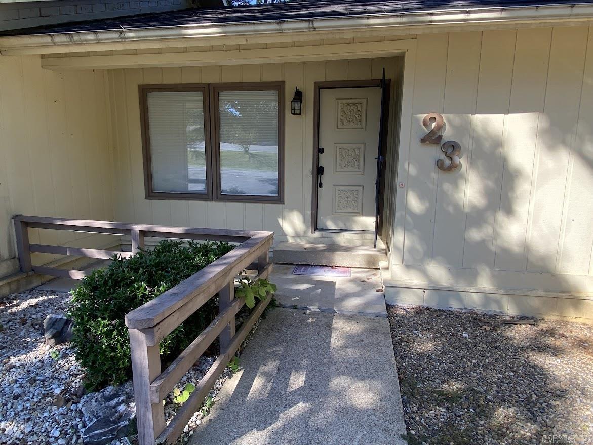 Charming and low-maintenance townhouse located in the heart of Hot Springs Village, the largest gated community in the U.S. This inviting home offers the perfect blend of comfort and convenience, ideal for full-time living or a peaceful getaway. Featuring a cozy layout with an open living and dining area, functional kitchen, and well-sized bedrooms, it provides just the right amount of space without the upkeep of a larger property. Enjoy your morning coffee on the private deck or take advantage of the Village’s incredible amenities, including golf courses, lakes, walking trails, fitness centers, and more. Nestled in a quiet neighborhood with mature trees and natural beauty all around, this townhouse is close to the West Gate for easy access to shopping, dining, and medical services. Whether you’re downsizing, retiring, or searching for a weekend retreat, this home is a wonderful opportunity to enjoy the relaxed lifestyle Hot Springs Village is known for.