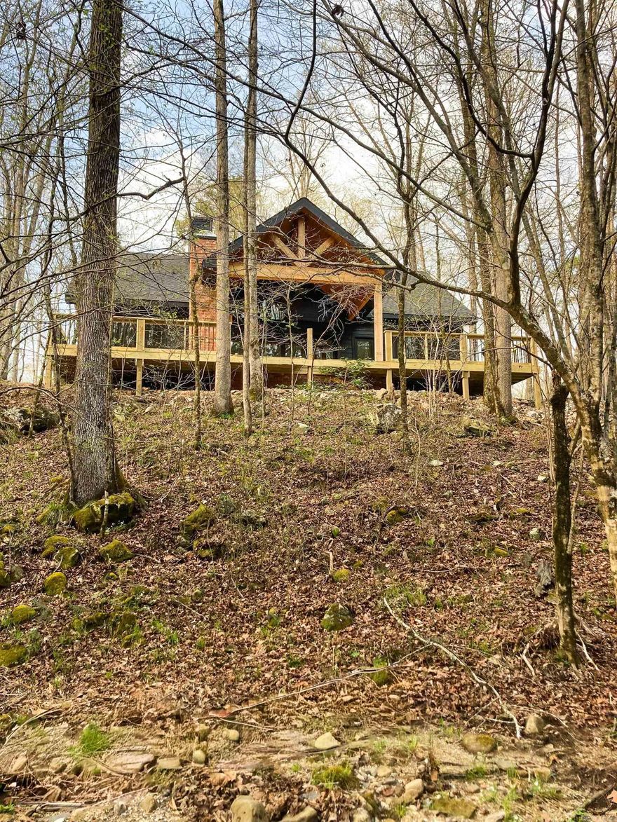 You do not want to miss this luxury lake home!  Escape to your own private paradise with this stunning 3 bed, 2 bath cabin + loft, perfectly nestled on 4 acres inside a breathtaking national forest   This property is the definition of peaceful luxury:  Indoor fireplace for cozy nights Outdoor fireplace on the back patio for entertaining under the stars Gas stove for the ultimate cooking experience Serene creek running along the back of the property Private hot tub to relax and unwind Fenced with gated entry for added privacy and security  Located just 4 miles from Crystal Springs Marina and Mountain Harbor Marina — enjoy boating, fishing, and lake days whenever you want!  Whether you're looking for a full-time retreat, vacation home, or income-producing property, this cabin truly has it all.  Privacy. Luxury. Nature. Convenience.  Message me for more details or to schedule a private showing!