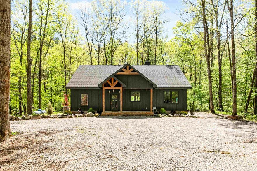 You do not want to miss this luxury lake home!  Escape to your own private paradise with this stunning 3 bed, 2 bath cabin + loft, perfectly nestled on 4 acres inside a breathtaking national forest   This property is the definition of peaceful luxury:  Indoor fireplace for cozy nights Outdoor fireplace on the back patio for entertaining under the stars Gas stove for the ultimate cooking experience Serene creek running along the back of the property Private hot tub to relax and unwind Fenced with gated entry for added privacy and security  Located just 4 miles from Crystal Springs Marina and Mountain Harbor Marina — enjoy boating, fishing, and lake days whenever you want!  Whether you're looking for a full-time retreat, vacation home, or income-producing property, this cabin truly has it all.  Privacy. Luxury. Nature. Convenience.  Message me for more details or to schedule a private showing!