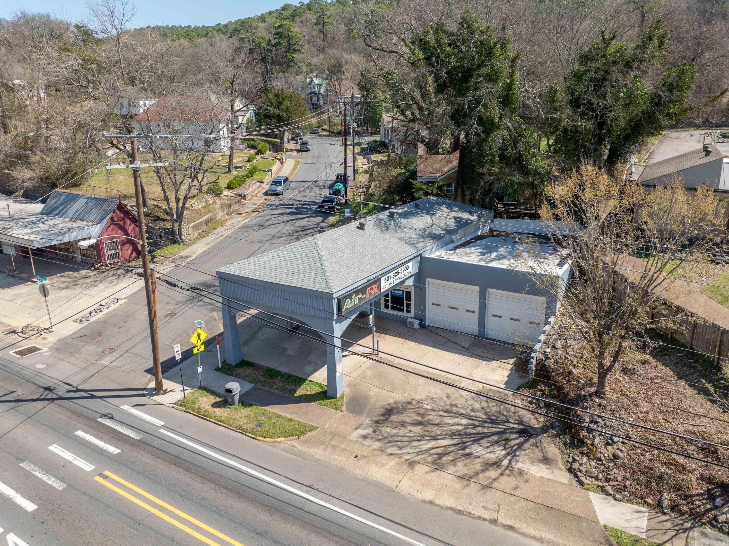 Amazing Opportunity! Corner lot on Park Avenue, zoned c-tr commercial. 2000 sqft 3 garage bay doors. There’s an office space a kitchenette and a half bath. New roof and new heating and air installed 2024. Anyone coming in or out of the historic downtown area will pass this building, unbeatable visibility so many options for this property! Agents see remarks.