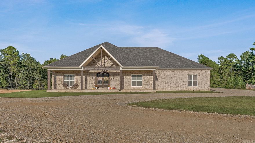 Welcome to Woodland Hills Estates - a stunning custom-built home on approx. 20 acres in a country setting just outside city limits. Built in 2024, this open-layout home features 10-ft ceilings throughout, creating a bright, spacious feel. Enjoy unmatched privacy with plenty of room to roam, yet stay minutes from town. Designed with comfort and security in mind, the home includes a hidden entrance in the kitchen island that leads to a downstairs safe room with a separate gun vault and lift-assist stairs. A unique blend of modern living and country charm.