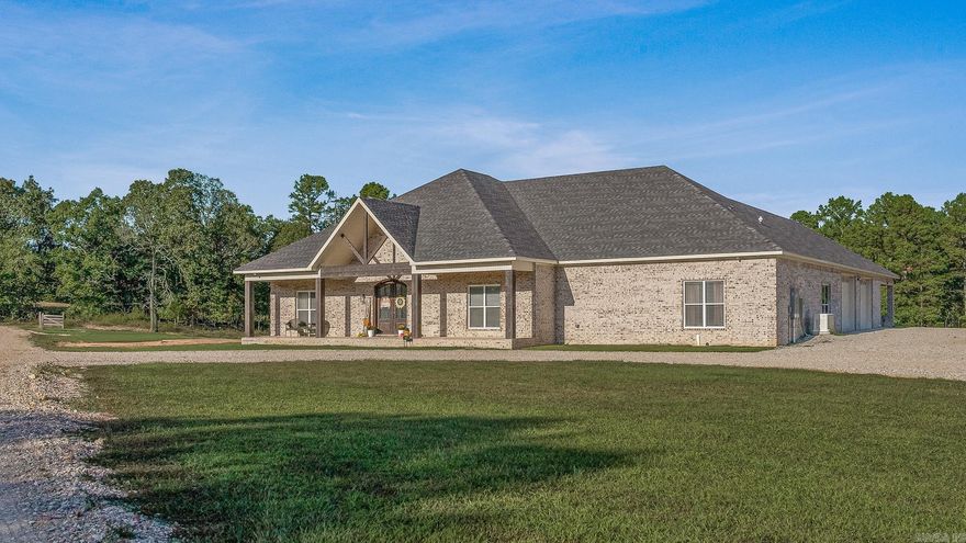 Welcome to Woodland Hills Estates - a stunning custom-built home on approx. 20 acres in a country setting just outside city limits. Built in 2024, this open-layout home features 10-ft ceilings throughout, creating a bright, spacious feel. Enjoy unmatched privacy with plenty of room to roam, yet stay minutes from town. Designed with comfort and security in mind, the home includes a hidden entrance in the kitchen island that leads to a downstairs safe room with a separate gun vault and lift-assist stairs. A unique blend of modern living and country charm.