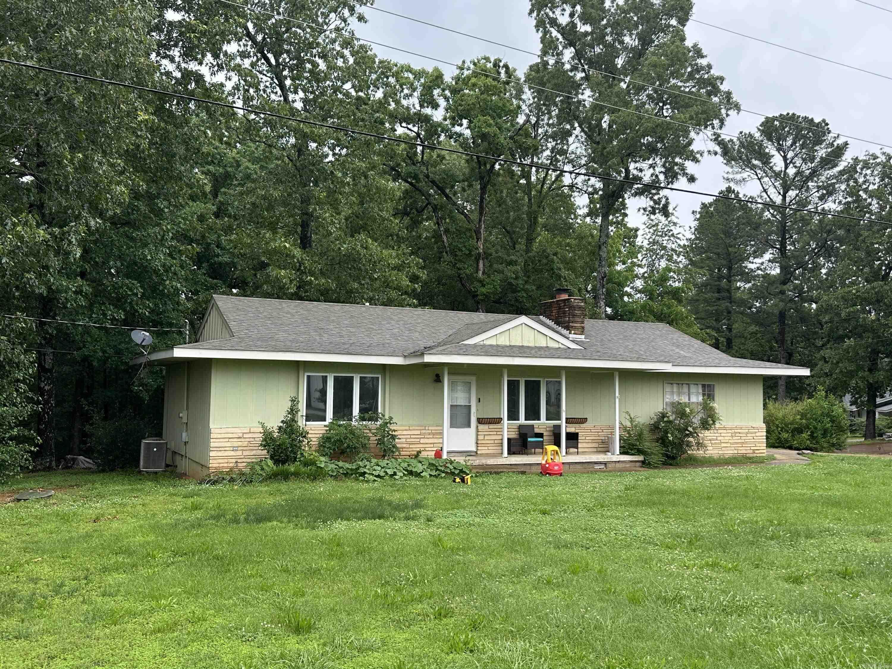 Charming Home on a Corner Lot in Cherokee Village āSELLER IS OFFERING A $5,000 CONCESSION FOR BUYER, WITH ACCEPTABLE OFFER Welcome to this well-maintained home sitting on a spacious corner lot in the heart of Cherokee Village, Arkansas.With approximately 1,230 sq ft, this home offers 2 bedrooms, 1 bathroom, and plenty of extra space for comfortable living. Large living room featuring a beautiful brick fireplace, perfect for cozy nights in. The kitchen is conveniently located with a bonus room just off the backāideal for a home office, sunroom, or extra storage.The home also includes a generously sized laundry room with a door leading directly into the two-car side-entry garage. Youāll enjoy central heat and air, an all-electric setup, and a large yard with room to garden, play, or entertain.Situated just off Highway 62 near the stoplight, the location offers easy access to everything Cherokee Village and the surrounding areas have to offer. Currently tenant-occupied.24-hour notice is required for all showings. Cherokee Village is known for its natural beauty, friendly community, and access to seven lakes, two private golf courses, a community center, and scenic walking trails.