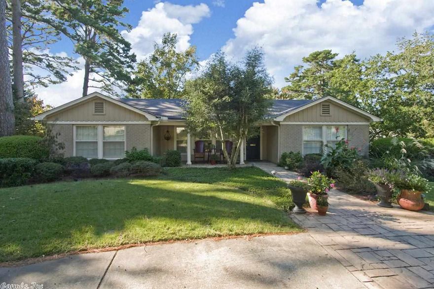 Beautiful hidden gem has loads of updating.  Large kit/bkft w/vaulted ceiling&all the appliances-new gas cooktop w/grill in middle, ice machine, built-in refrigerator, slab granite countertops, large window over sink overlooking .76 acre lot.  New master suite has new bath&huge closet&place for stack washer.  Picturesque deck.  Lower level has 3 bedrooms, big den&patio, 2 baths, big laundry rm, loads of storage.  Triple carport behind auto gate. Bsketball court, green house, workshop, big play set for kids.