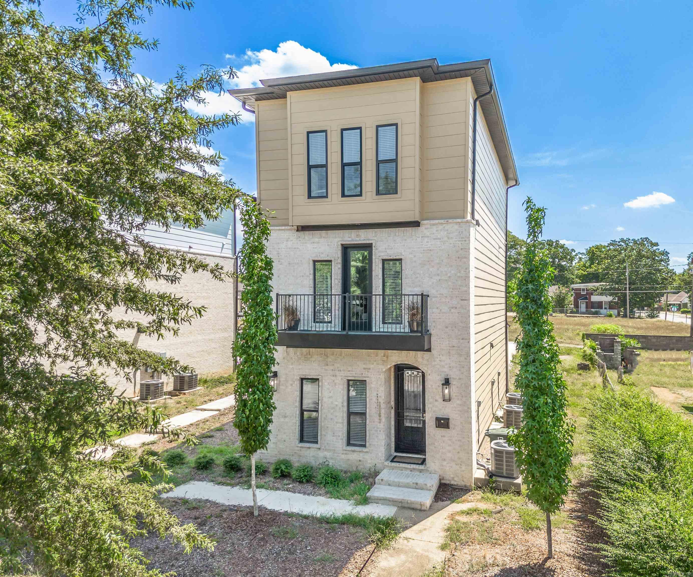 Welcome to 1867 S Ringo Streetāan exceptional newer construction residence offering three levels of sophisticated living in the heart of Little Rock. This thoughtfully designed 3-bedroom, 3.5-bath home features ensuite bedrooms on every floor, ensuring ultimate privacy and flexibility. The first floor hosts a private guest suite with its own bath, while the second floor boasts an open-concept living area with beautiful hardwood floors, abundant natural light, and a stylish kitchen complete with stainless steel appliances, granite countertops, a butcher block island, and custom cabinetry. Upstairs, youāll find two spacious bedroomsāeach with a private bathāand a convenient third-floor laundry area. Smart details throughout include recessed lighting, crown molding, modern fixtures, and a premium carpet runner on the stairs. The rear-entry garage is EV-ready, providing both secure parking and modern convenience. Located minutes from downtown, this home blends upscale urban living with comfort and efficiencyāperfect for professionals, investors, or anyone seeking stylish space near the cityās vibrant core.