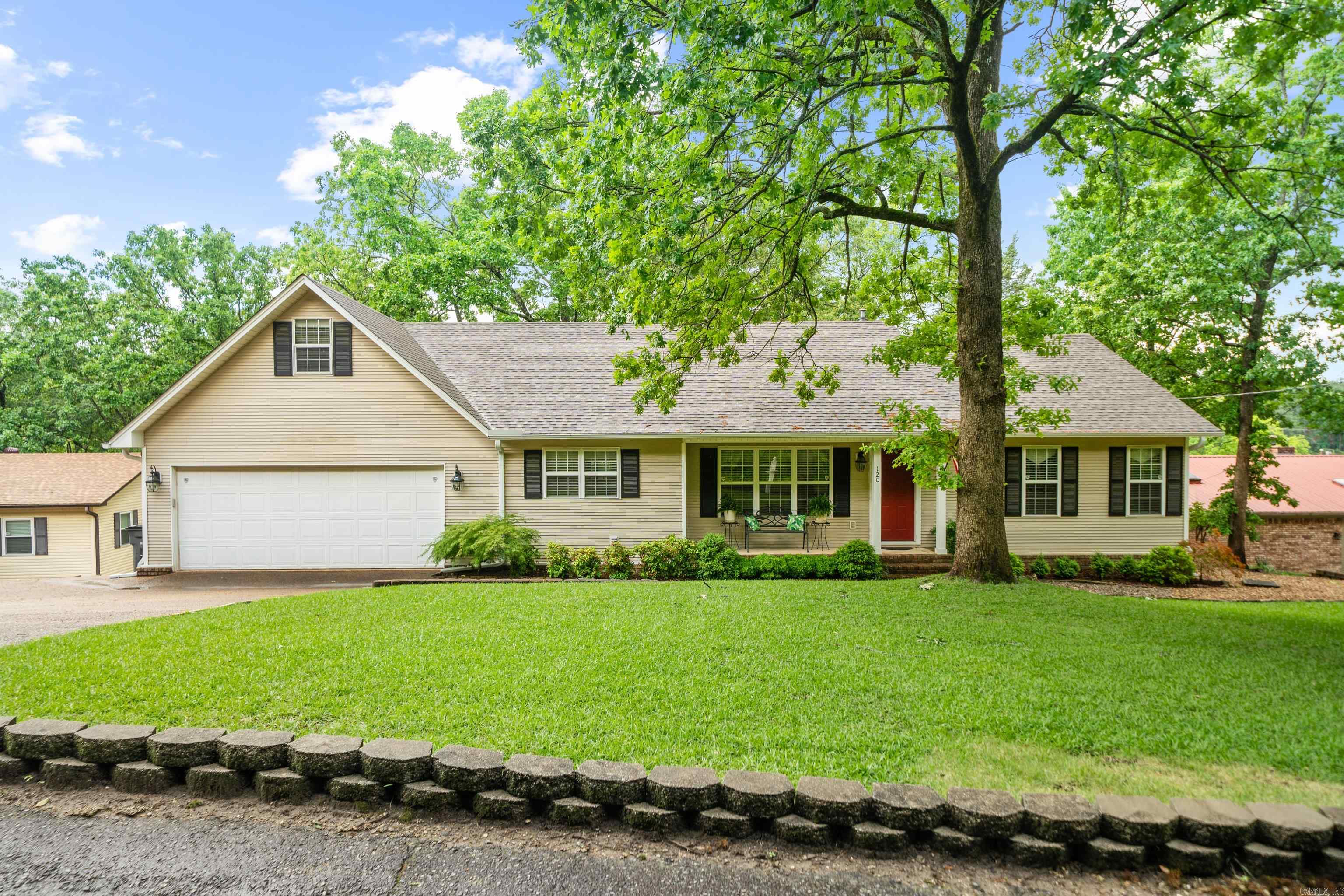 Welcome to your dream lakefront oasis on the stunning shores of Lake Hamilton! This beautifully maintained 2,500 sq ft home offersbreathtaking panoramic views, exceptional outdoor entertaining spaces, and a highly functional layoutāperfect for full-time living or aluxurious vacation retreat. Featuring 3 bedrooms and 2 full bathrooms, this home boasts a desirable split floorplan that ensures privacyand flow. The spacious primary suite is a true ownerās retreat with a large ensuite bath, walk-in closet, and picturesque views of the lake.The heart of the home is an open-concept living and dining area designed for entertaining and everyday comfort. Whether you'reenjoying a cozy evening inside or hosting guests, this home delivers comfort and elegance in equal measure. The kitchen offers amplestorage, a functional layout, and clear sightlines to the lakeāperfect for casual dining or family gatherings. Step outside to your very ownoutdoor paradise. A large screened-in porch overlooks the water and serves as a peaceful year-round escapeāideal for morning coffee,evening cocktails, or enjoying the natural beauty without the bugs. Additional open-air patios and outdoor spaces provide even mo