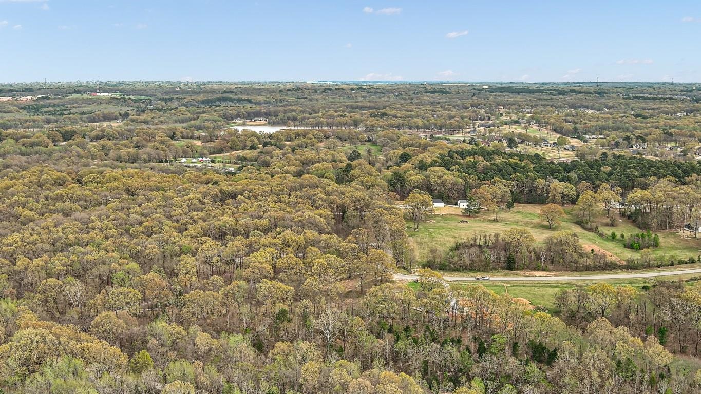 Nestled on 18 pristine acres of lush, wooded terrain, this exceptional property offers an unparalleled opportunity for those seeking both serenity and proximity to modern living. Tucked adjacent to one of Jonesboro, Arkansas’s most prestigious housing developments, this expansive parcel provides a rare blend of natural beauty and convenience. Towering trees and gentle topography create a peaceful backdrop, ideal for creating a private retreat or developing a distinguished estate. This property’s unique location ensures easy access to the best amenities in Jonesboro while maintaining the tranquility and seclusion of a rural setting. With its ample space and breathtaking surroundings, the land is perfectly suited for a visionary homeowner or investor looking to capitalize on one of the area’s most coveted locales.