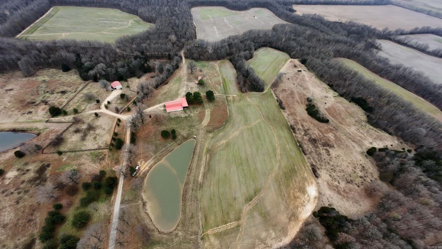 262± acres on Crowley’s Ridge National Scenic Byway in Boydsville, AR. Features 172± acres of premier recreational hunting land, 85± acres of productive row crop, and 5± acres of residential ground. Trophy whitetail deer and excellent turkey hunting with two stocked ponds. Improvements include an 1,100 sq ft heated and cooled 26’x42’ shop, a well-maintained barn, and a 33’ fifth-wheel camper with 3 slide-outs. Cross-fenced pasture ideal for cattle. Clay County Electric and water available. Secluded setting just 1 mile off pavement—true hunter’s paradise.