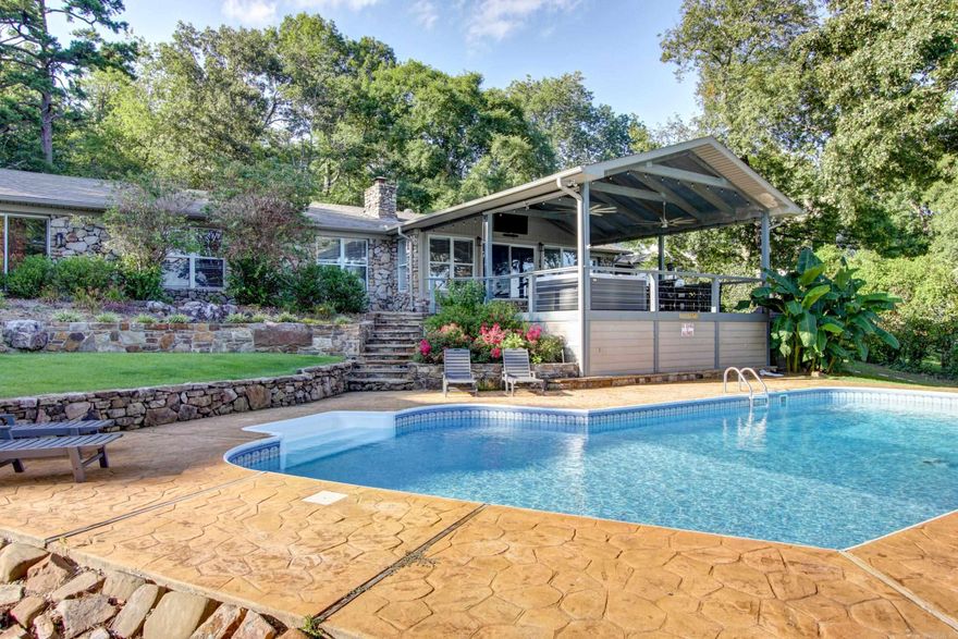 This Lake House has it all! Salt-water pool, 40x30 high end finished bunk house with two bathrooms, 2 stall boat dock with swim platform. House was totally remodeled in 4 years ago. Outstanding view of the main channel with a 180degree view. Custom kitchen with wine cooler, ice maker, updated appliances, updated colors and solid surface countertops. The newly constructed back deck/patio is an entertainers dream. Enjoy the view of Lake Hamilton from this outstanding covered deck and hot tub!! This home is an active short term rental. So if you are looking for an amazing investment property, it has you covered there too! **AGENTS: see notes.