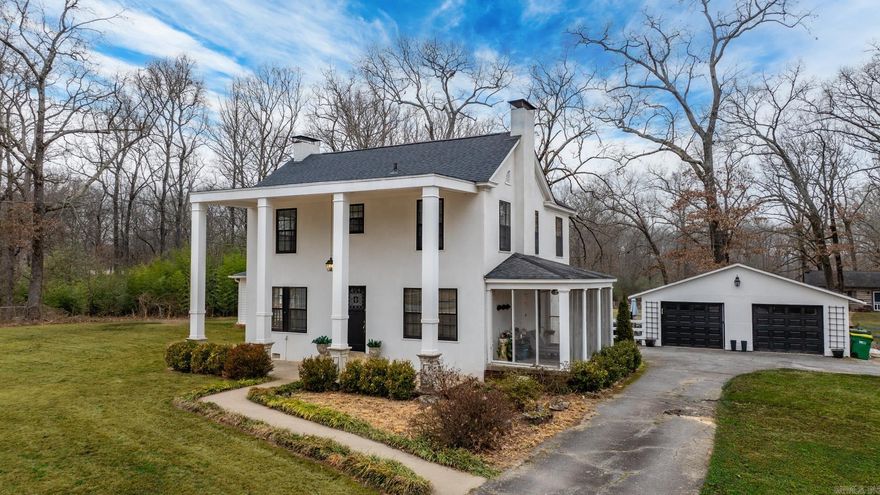 Listed BELOW APPRAISED VALUE!!  Step inside this rare gem of Arkansas history where the city of Sherwood began. Situated on six pristine acres with luxurious updates.  This 1915 updated colonial style home is the former Kellogg Homestead.  The beautiful open kitchen is a chef's dream with luxury granite countertops, two sinks, gas range, ice maker, and abundant storage.  The open kitchen shelves were created from trees on the property.  The stunning separate master suite provides comfort and privacy.  Upstairs, you will find three bedrooms, a bonus space and a full bathroom.  Enjoy lavish entertaining with two living areas, a dining room, screened porch, and an outdoor firepit area. The original 1848 cabin is also located on the property & has an updated bathroom, new point of use hot water heater, & new mini split.  The barn will accomodate several horses or can be used for equipment storage.  The oversized two car garage will meet all of your storage needs.   This unique property is a delight that you do not want to miss! *Sq. Ft. of log cabin (954) IS NOT included in overall Sq. Ft* Home 2,799 sq ft*