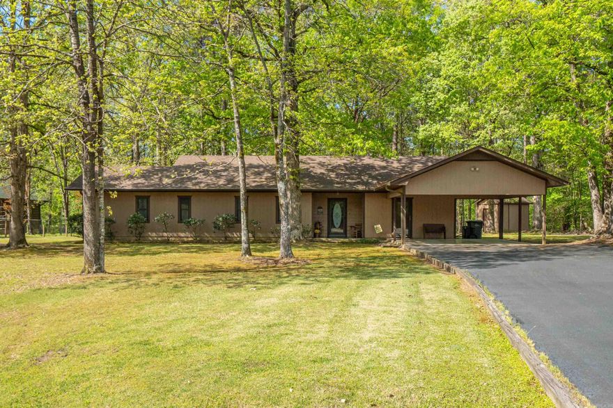 Tranquility and privacy awaits in this extended ranch style 4 bed/2 bath home in Fountain Lake School District. The open kitchen/living room allows for entertaining that can spill out on to the porches in the front and back yard! Nestled on 1.53 acres with a creek at the back of the property and a wet weather creek in the front yard, this property is lush with plants that bloom throughout the year. A 2 car carport allows easy parking access to the laundryroom/mudroom, and kitchen. This property is in Walnut Valley Estates, which offers covenants that keep the neighborhood clean and quiet! Just minutes from the school, the new bypass and the Mountain Valley Spring Water bottling facility. Roof and HVAC were both replaced on 2019 and water heater only a few months old!