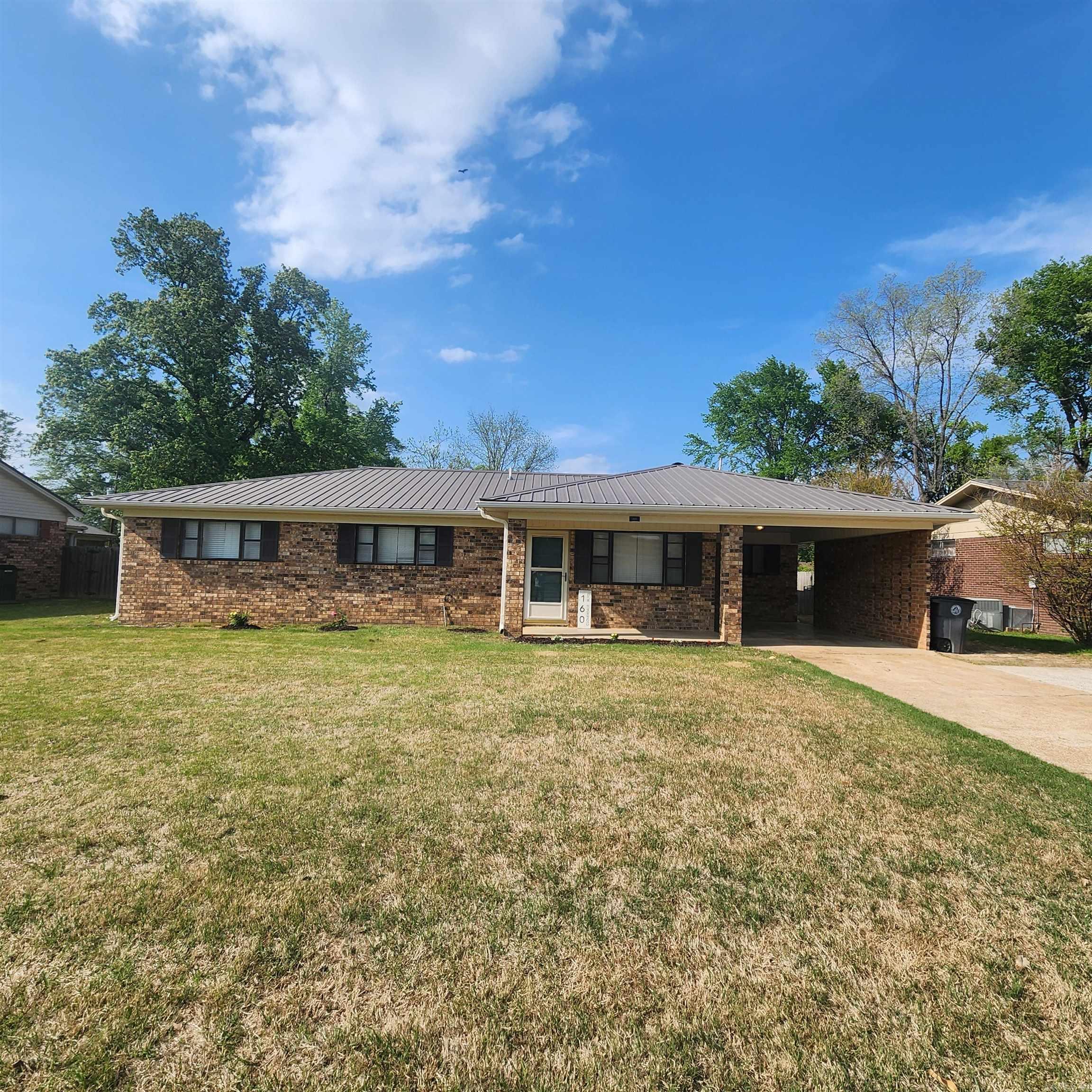 This 3 bedroom, 2 bath brick house has a metal roof, gutters, privacy fenced in back yard, 10 x 12 storage building with electric & updated Amana HVAC. The kitchen was recently remodeled with tile backsplash. No carpet, all wood, vinyl plank laminate & tile flooring. Wood deck with gazebo for entertaining. Should qualify for all loans but seller selling in current condition. Across the street from Sydney Deener Elementary school & close to churches, restaurants, shopping, Harding University & more. See agent remarks!