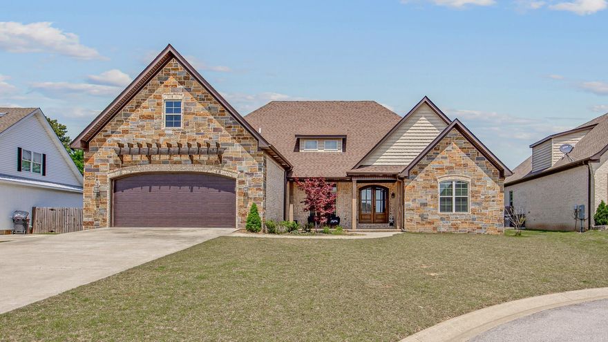 Magnificent 4 bedroom (3 on main level) & 3.5 bath home in cul-de-sac in Jamestown Manor. The impressive vaulted with wooden beams is stunning. A large separate dining, stone fireplace, that leads to the  screened in back porch that overlooks the level backyard (yes - room for a pool!). The kitchen is a show stopper! Pale grey custom cabinetry, soft close hardware, champagne gold fixtures & is absolutely stunning with the granite countertops. Stainless appliances & a pot filler over the 5 burner gas stove are a chef's heaven. The large island has storage & seating, and eat-in kitchen area. The main level has lovely, warm & inviting hardwood flooring throughout. Spacious master suite is dreamy with tray ceilings, huge walk-in closet with built-ins and a spa bathroom with luxurious soaker tub, dual vanity and tiled walk-in shower with large bench seating. Two additional bedrooms are located on the main level and share a perfectly designed jack and jill bath. Upstairs is a large bonus room with plush neutral carpeting and private bathroom with walk-in shower that would make a great fourth bedroom. Call to see this beautiful home today!!
