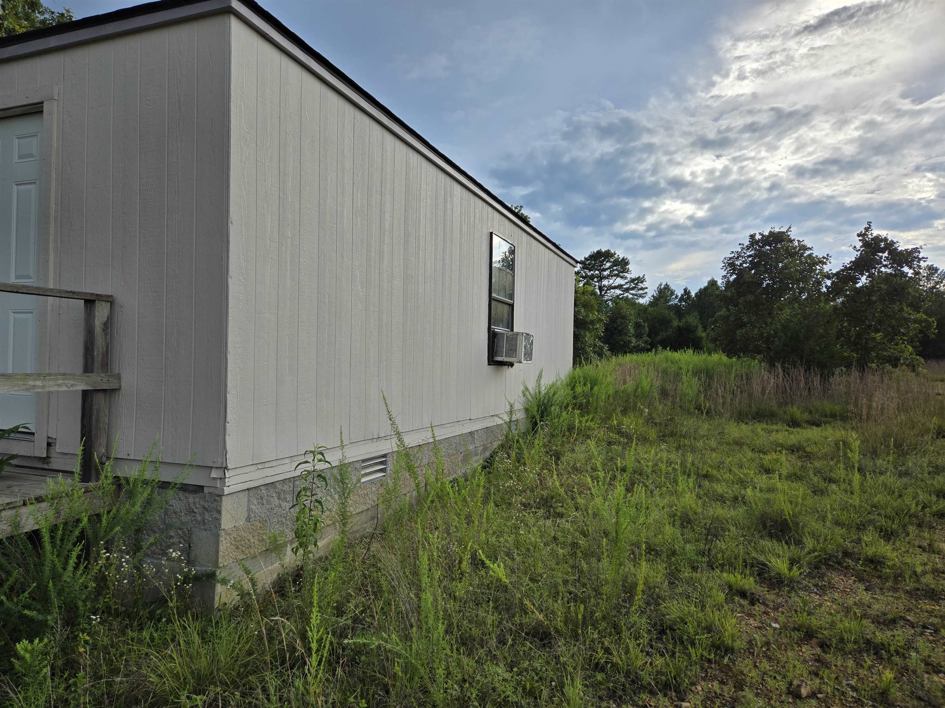 This little cabin in the country is a hunter's dream! Brimming with large deer and turkeys, this place features a small cabin with electricity and a bathroom, a pond, and all the peace and quiet you can handle - all on 8 level acres to enjoy it on. Well on the property. There is no septic on the property.