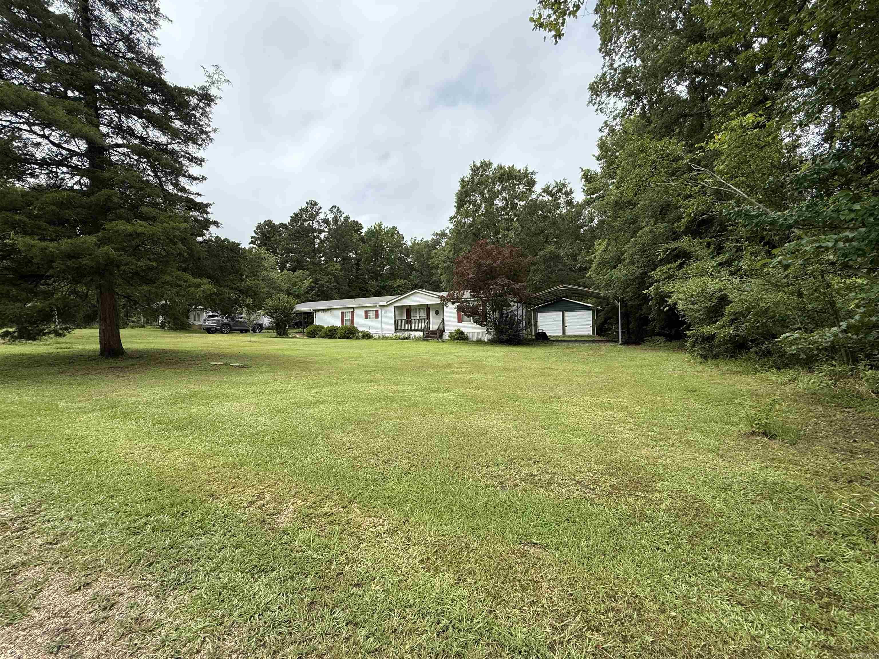 Escape to the tranquility of country living while staying close to town! This charming 3-bedroom, 2-bathroom property offers the best of both worlds on over 5 acres of scenic land. The kitchen boasts a pantry for added storage, making it both functional and inviting. Electric stove with dishwasher and seller plans to add a fridge before closing. Large living room perfect for entertaining. Outside, youāll find a shop, a storage building, and a double carport, providing ample space for hobbies, projects, and parking. Nestled on a quiet country road, this property is perfect for those who value peace and privacy without sacrificing convenience. Donāt miss the opportunity to make this slice of country paradise your own!