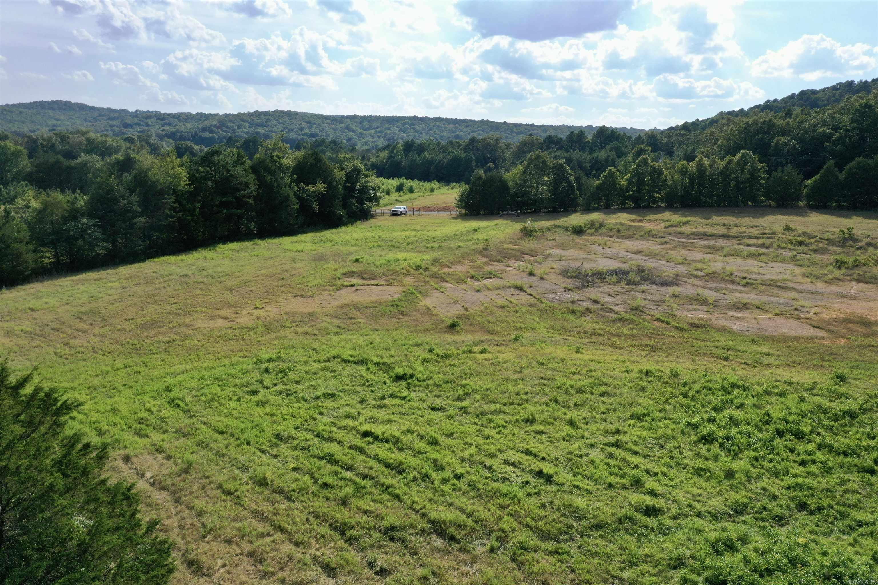 20 acres more or less with a pond, dead-end gravel road.