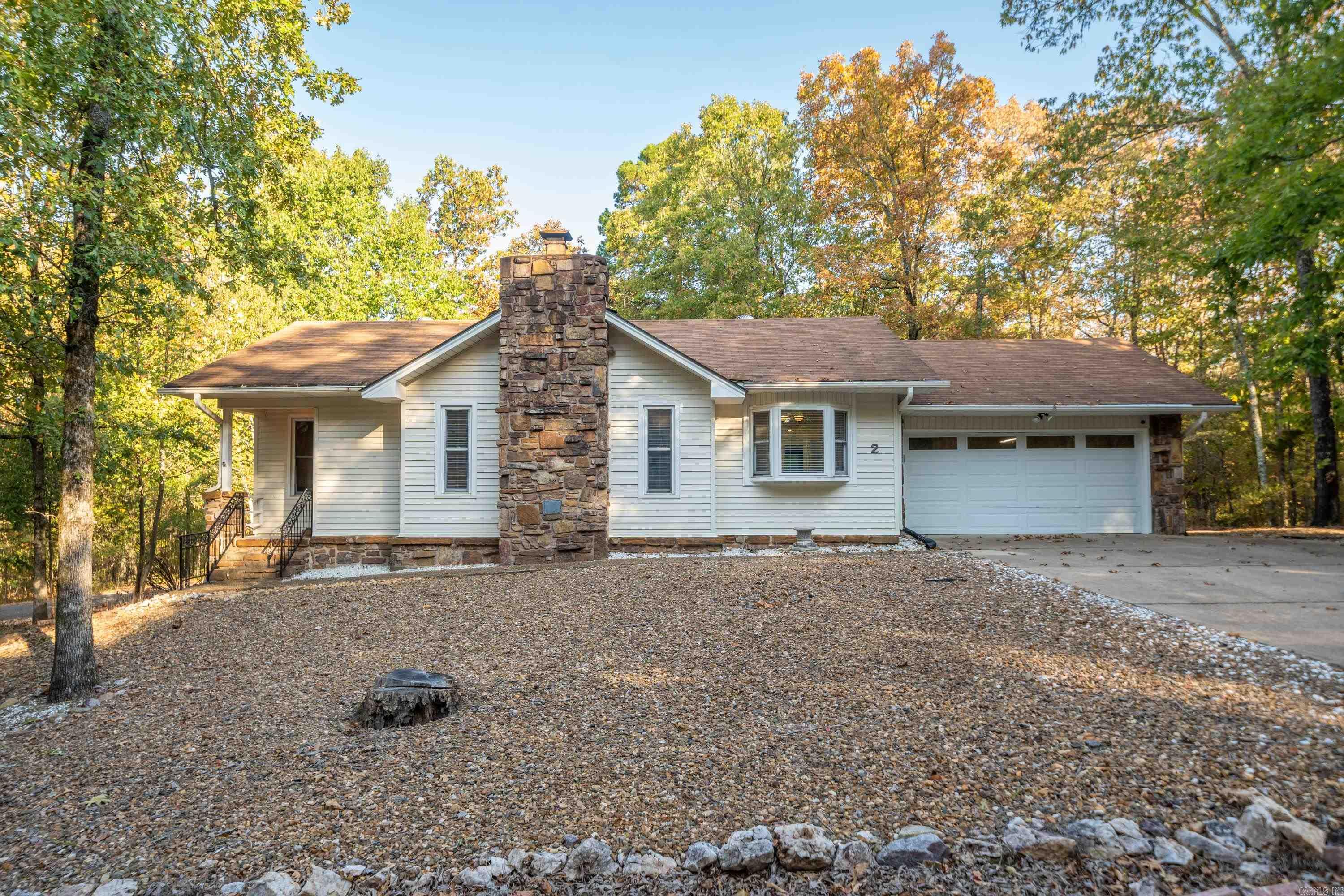 NOT A RENTAL! Looking for a Move-In Ready Retreat in the prized Jessieville School District with Maximum Privacy & opportunity to launch your boat or go fishing just 2 minutes from your driveway? You can also be at the Coronado Fitness Center in 5 mins or less! How about multiple golf courses within 5 minutes? You've got it! You will love the Vaulted & Beamed Ceilings in both the Living Room & Sunroom (20x12). A beautiful Stone Fireplace with Stone Hearth anchors the Living Room & provides warm ambiance for your Dining Room as well. There is No Carpet so it's wonderful for those who have pets or like easy cleaning! The Kitchen & Bathrooms have been updated with an upgraded movement-style Granite and there are 2 walk-in showers. There is also new vinyl double-hung windows & sliding glass doors that lead to the 18x10 Deck & Fenced Back Yard. An oversized Garage is 24' deep for tinkering at a work bench or storing a boat or motorcycle if you like. Since purchasing last year, the Seller spent over $25,000 updating these items so you don't have to: Fencing, Wood Flooring, Granite Countertops, Electrical & Plumbing Updates, & Interior Paint throughout. HVAC Compressor parts replaced 2022