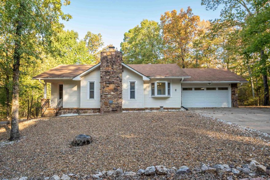 NOT A RENTAL! Looking for a Move-In Ready Retreat in the prized Jessieville School District with Maximum Privacy & opportunity to launch your boat or go fishing just 2 minutes from your driveway? You can also be at the Coronado Fitness Center in 5 mins or less! How about multiple golf courses within 5 minutes? You've got it! You will love the Vaulted & Beamed Ceilings in both the Living Room & Sunroom (20x12). A beautiful Stone Fireplace with Stone Hearth anchors the Living Room & provides warm ambiance for your Dining Room as well. There is No Carpet so it's wonderful for those who have pets or like easy cleaning! The Kitchen & Bathrooms have been updated with an upgraded movement-style Granite and there are 2 walk-in showers. There is also new vinyl double-hung windows & sliding glass doors that lead to the 18x10 Deck & Fenced Back Yard. An oversized Garage is 24' deep for tinkering at a work bench or storing a boat or motorcycle if you like. Since purchasing last year, the Seller spent over $25,000 updating these items so you don't have to: Fencing, Wood Flooring, Granite Countertops, Electrical & Plumbing Updates, & Interior Paint throughout. HVAC Compressor parts replaced 2022