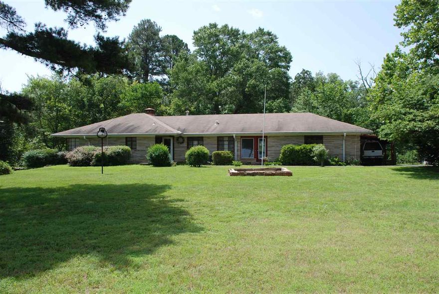 Very well-maintained home in convenient location. 2BR/1.5BA on main level, but additional 1BR+bonus room and bathroom in basement. Full walk-out basement has enough room for a complete living area and bedrooms/bathroom and even a place for a kitchen if you installed one. Indoor workshop off 2-car garage and separate building for add'l shop or storage. Pond and roomy yard. Fantastic location and move-in ready!