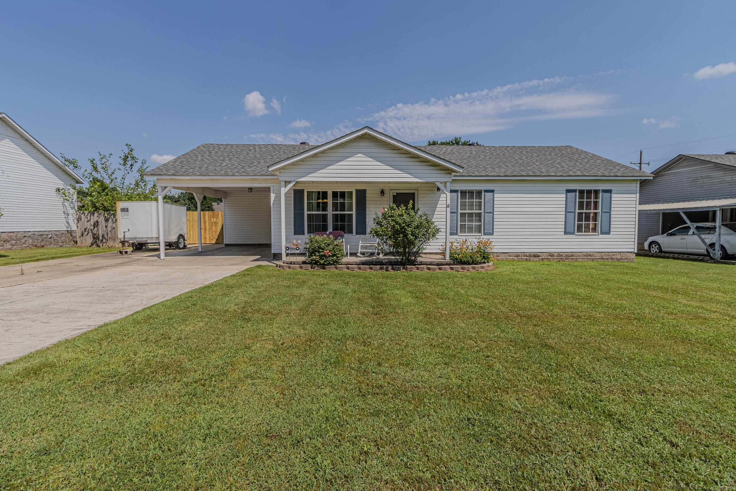 This inviting home features a vaulted living room that flows seamlessly into the open kitchen and dining area, creating the perfect space for everyday living and entertaining. The walk-in laundry room offers added convenience, while recent updatesāincluding updated flooring, fresh paint throughout, a newer back deck, a new roof, and a new HVACāmake it truly move-in ready. Outside, youāll find a storage building and a concrete pad (kennel and awning do not remain), offering flexible use for hobbies or additional storage.