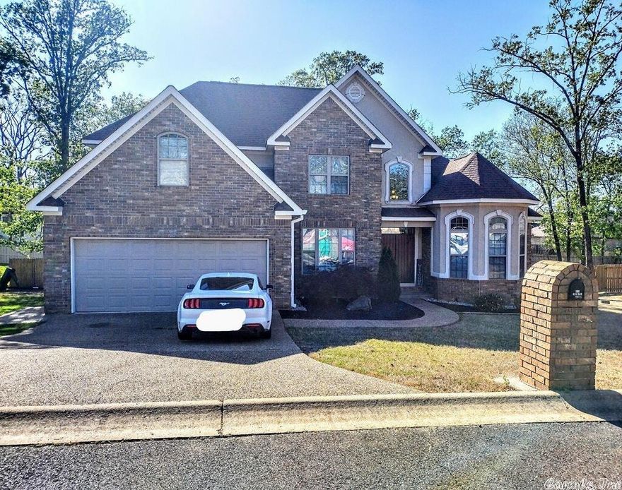 WELCOME to 111 Big Oak Trail, Hot Springs, Arkansas! Fall in love with this 5 bedroom, 3 bath home just minutes from all Hot Springs has to offer. Beautiful crown molding, hardwood floors, custom stair rails, an amazing kitchen AND an outdoor living space are a FEW of the luxuries you'll find in this home, located in a desired neighborhood of Lake Hamilton School District.  Schedule your own private tour today!