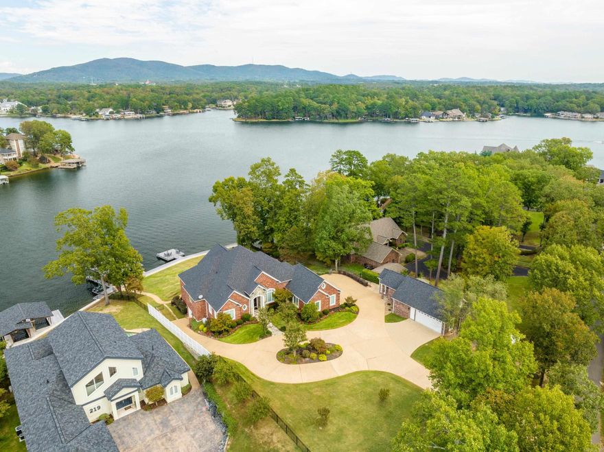 One-of-a-kind Lake Hamilton Estate with over 193' of lake frontage and 1.14 acres fully fenced and only 1.5 miles to Airport Road and 3 miles to the Bypass. Main House is 4908 Sq. Ft. with 5BR/4.5BA. The Detached Office & Movie Theatre is 602 Sq. Ft. and includes a 2 Car Garage, Half Bath, Kitchenette/Wet Bar, Pop Corn Machine, High-End Theatre and Sound System Electronics and 9 Luxurious Beautiful Red Recliners for your movie viewing pleasure. This is luxury lake living at its finest with no attention to details overlooked. Master Suite and 2nd and 3rd Bedrooms and Baths, Kitchen, Breakfast Bar, Breakfast Nook and Great Room, Formal Dining Room and Utility Room are all located on the main level. The lower level is an In-Law Quarters with a full Kitchen, Bedroom, Bathroom, Washer/Dryer, Safe Room, Workout Room/Golf Cart Garage, and a Large Office that could be used as a 6th Bedroom with a closet located across the hall.