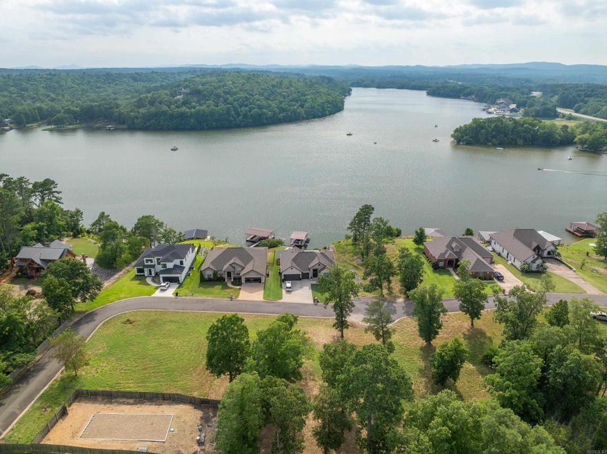A gorgeous site for your New home in the new gated neighborhood at Oak Ridge Lake Estates. This is a gentle sloping lot with BIG panoramic views across Lake Hamilton with colorful sunsets included. Only a minute’s drive from Hwy 270, which means you're also a short drive from Lake Ouachita, offering you TWICE the fun with quick access to the best two lakes in Arkansas. The area is one of the last few undeveloped areas on the lake, offering you a great opportunity to invest and build your forever home.